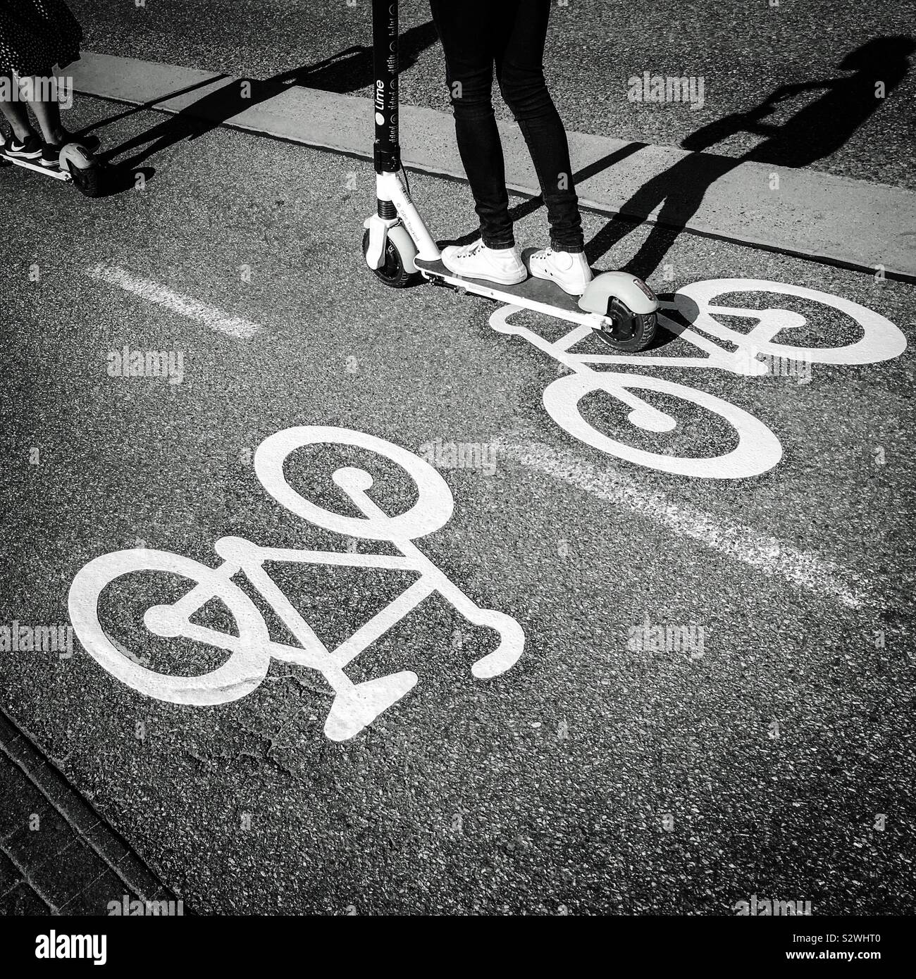 Two Escooters riding on cycle path, Stockholm, Sweden, Europe Stock