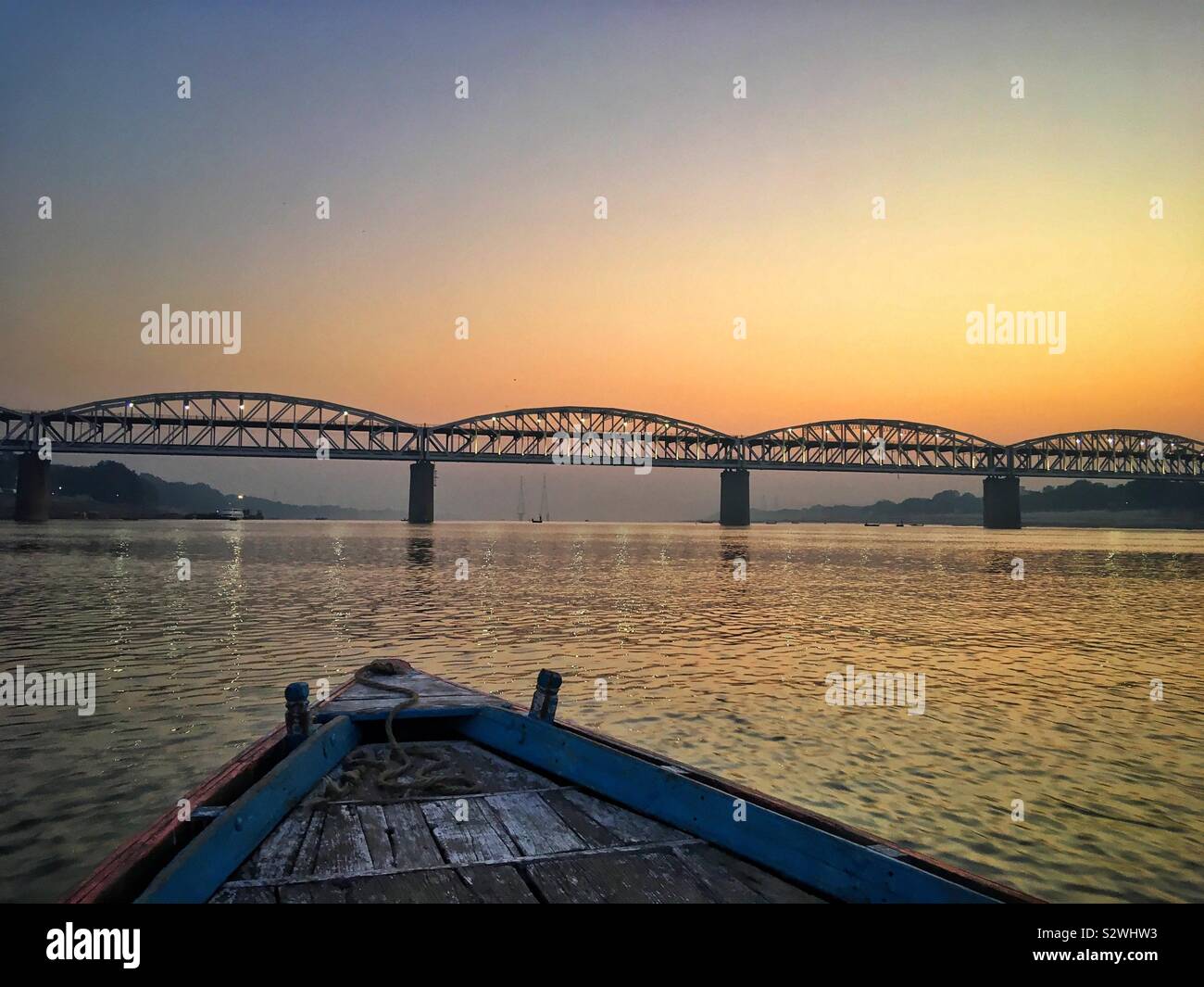 Sunrise on the River Ganges at Varanasi with the Dufferin Bridge. Stock Photo