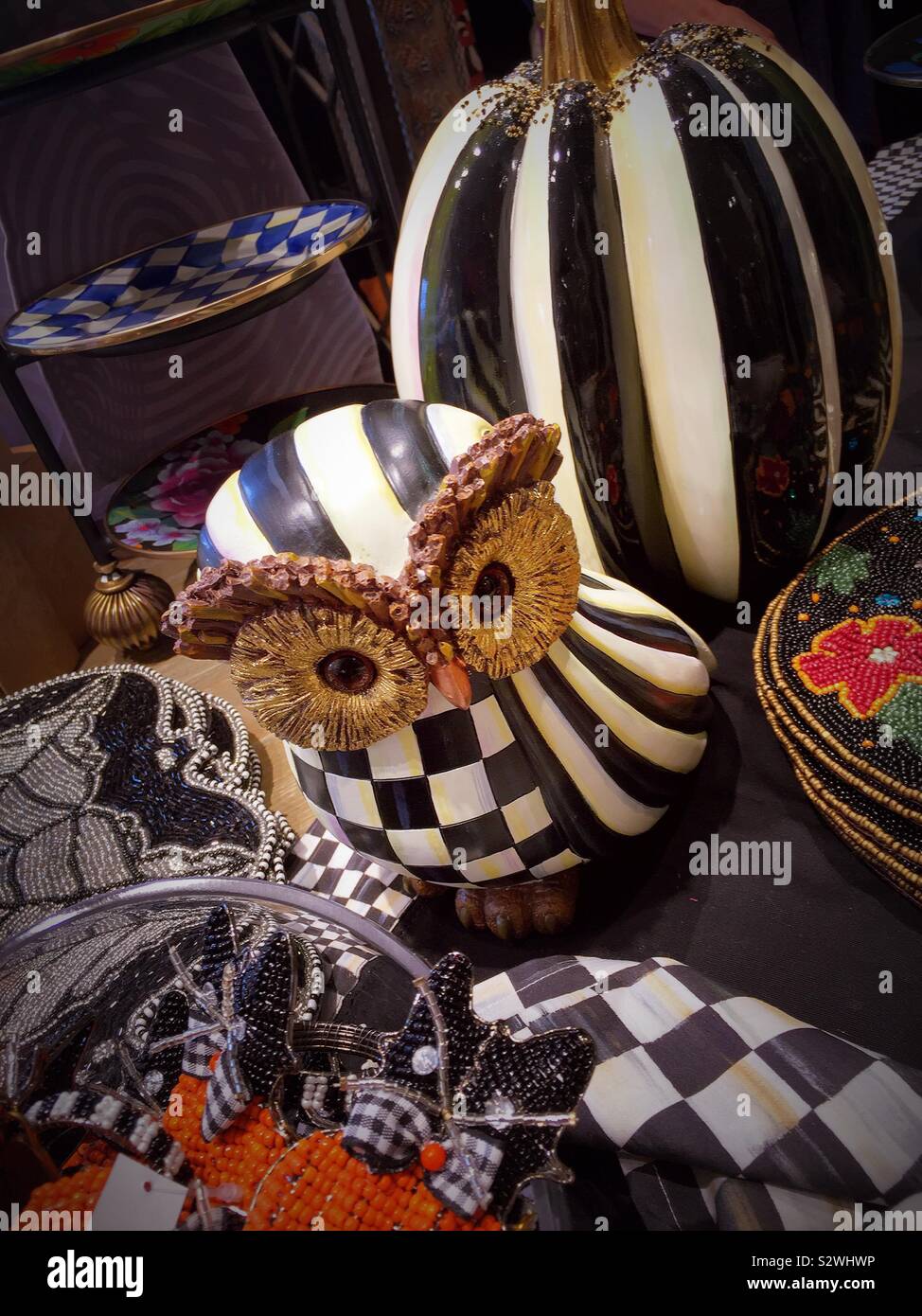 Owl Display of an owl and pumpkins in colorful patterns on sale at Mackenzie Childs in Soho, NYC, USA - Smartphone Captured Stock Image