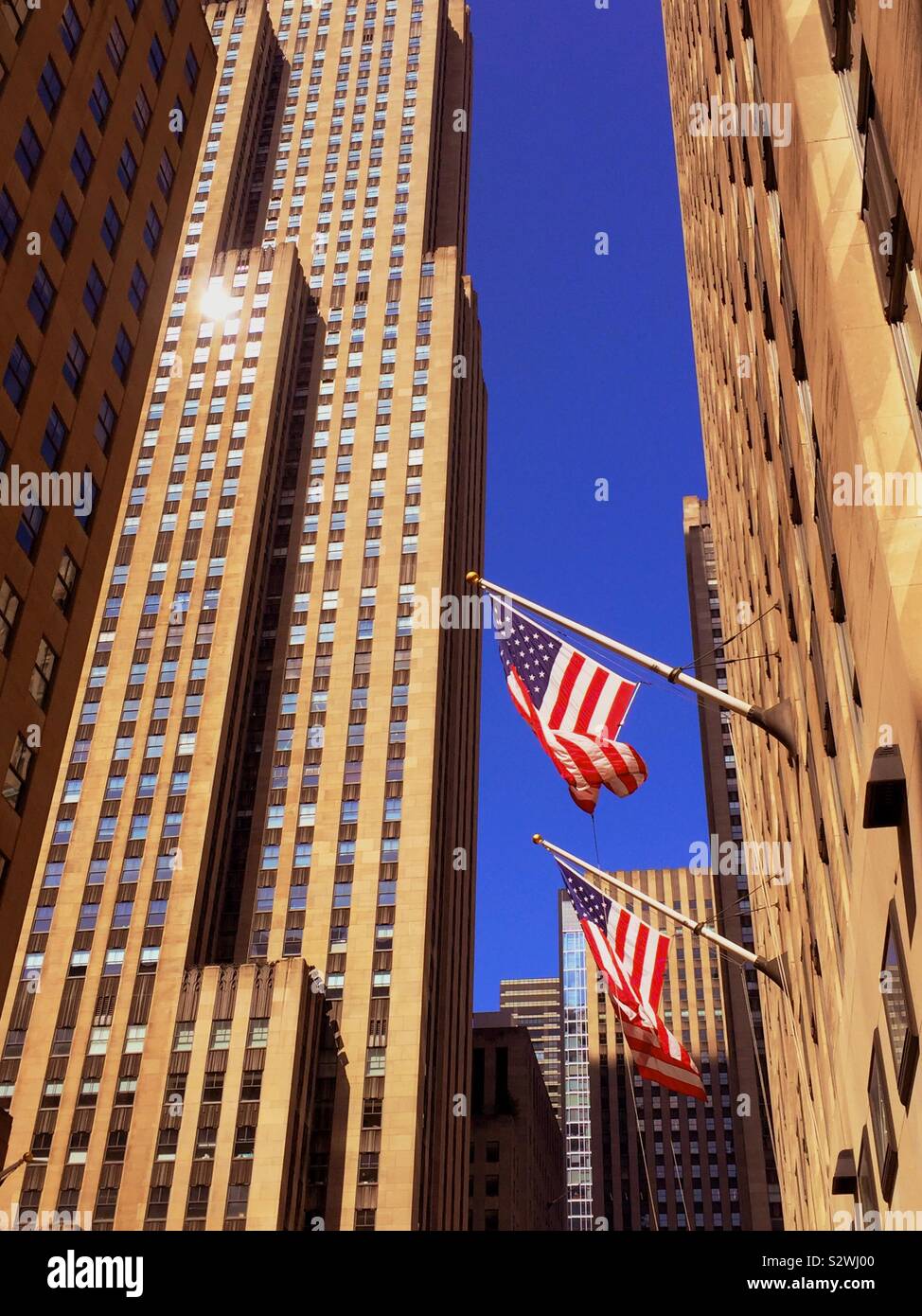 American flags proudly flying in Rockefeller Center, midtown Manhattan