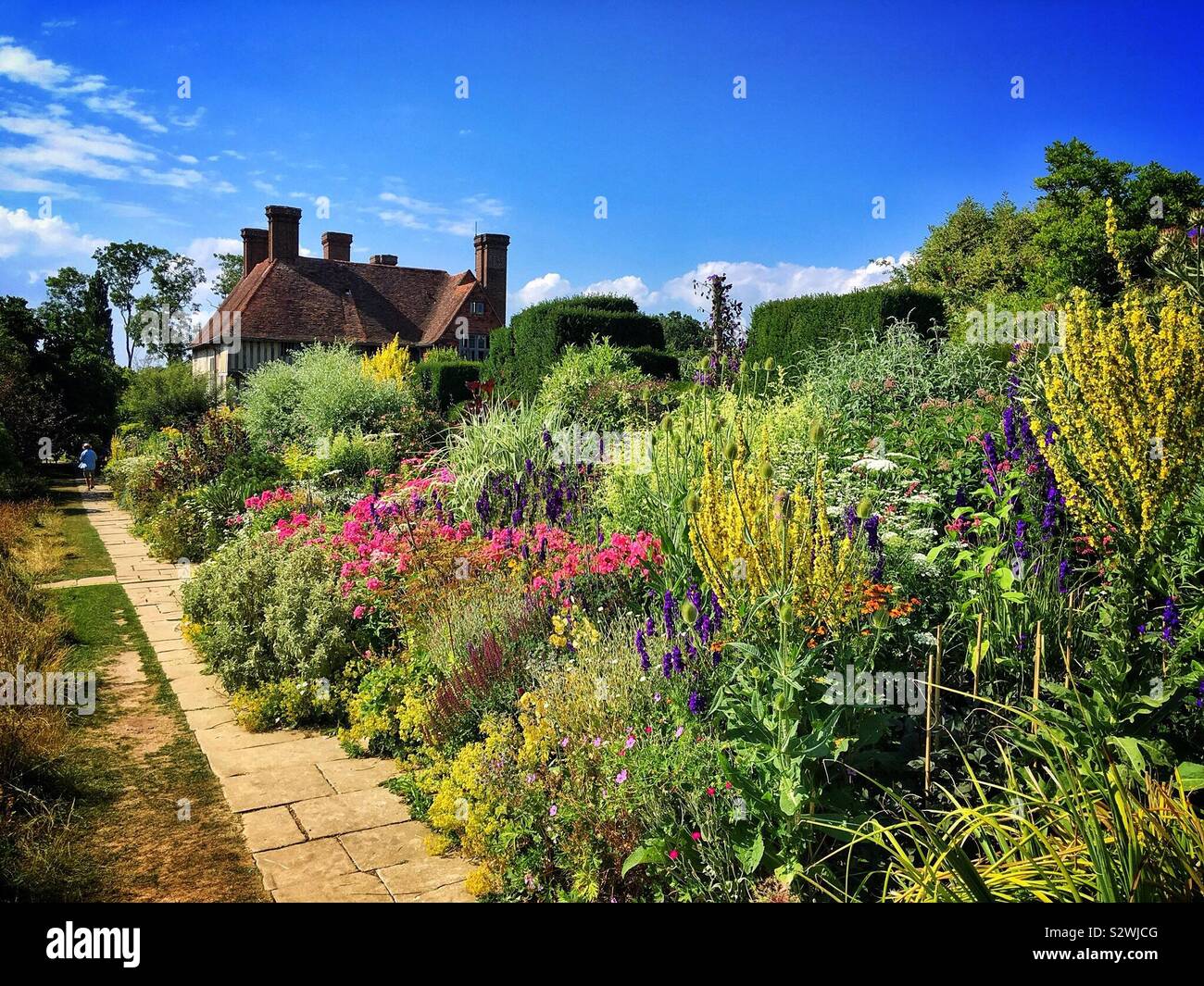 Herbaceous flower border in summer at Great Dixter in East Sussex, probably the best English cottage style gardens. Stock Photo