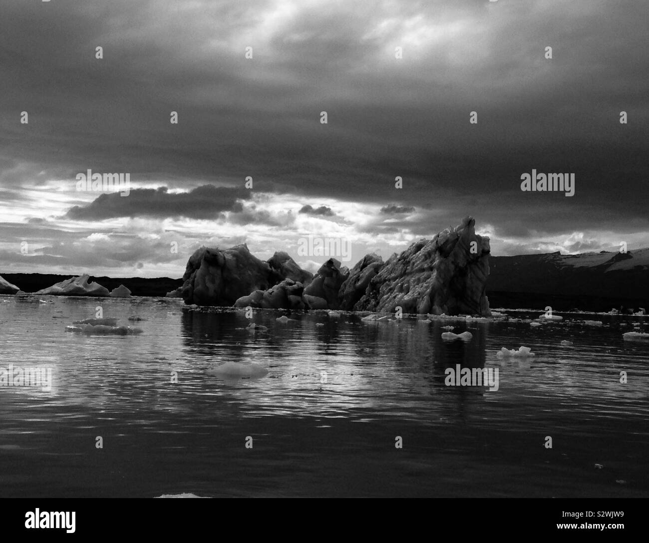 Image of iceberg in Iceland, floating in water in black and white Stock Photo