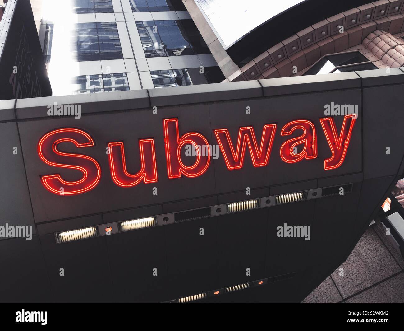 Huge brightly lit subway sign at the 42nd St. station in Times Square, NYC, USA - Smartphone Captured Stock Image