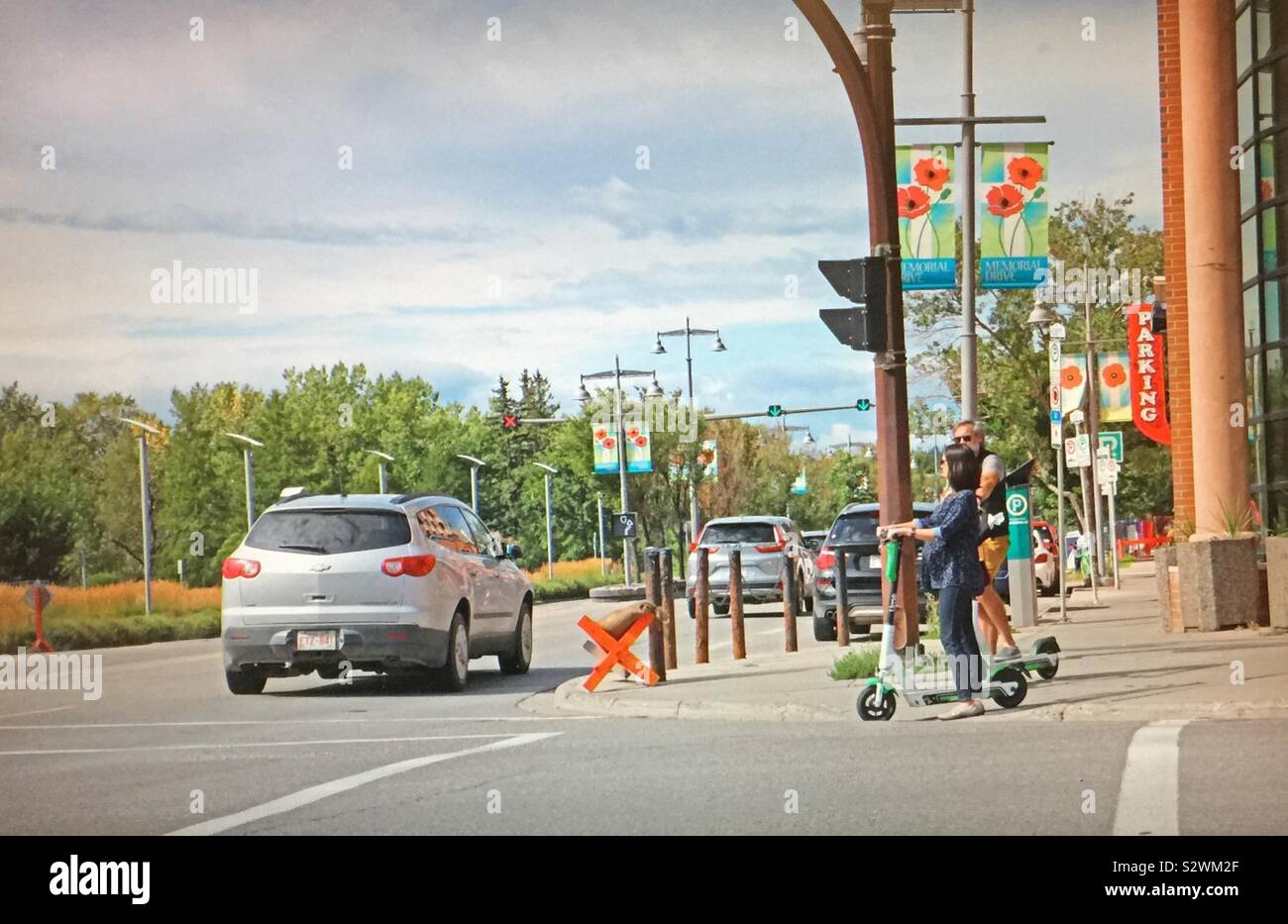 Street photography in Kensington in Calgary, Alberta, Canada, electric scooters - Smartphone Captured Stock Image