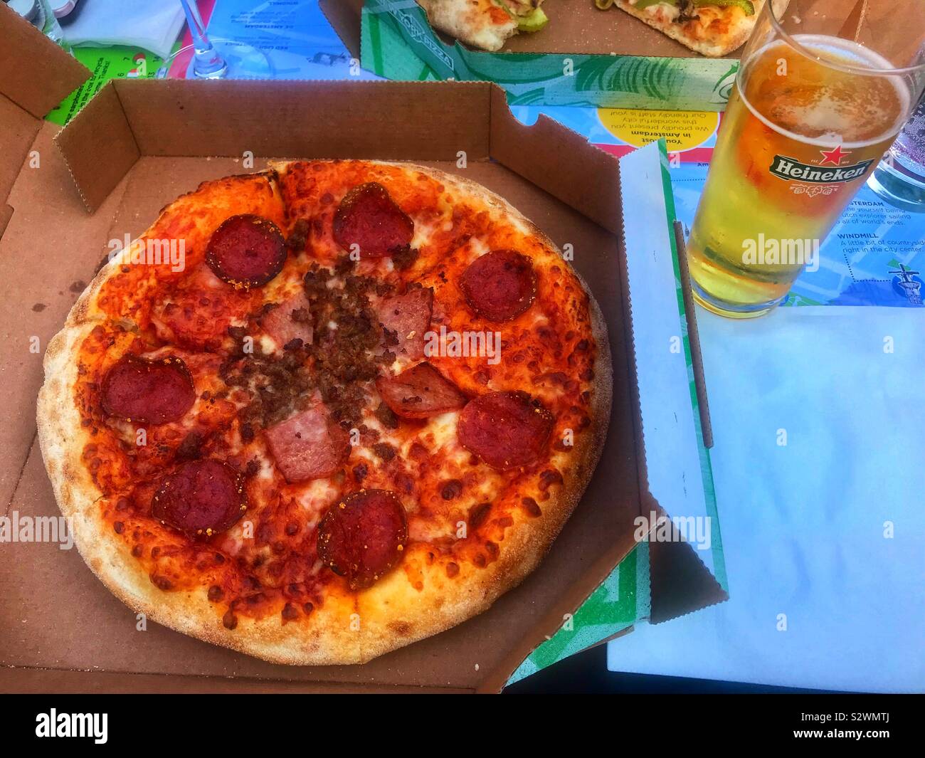 Pizza and beer canal cruise Amsterdam Stock Photo