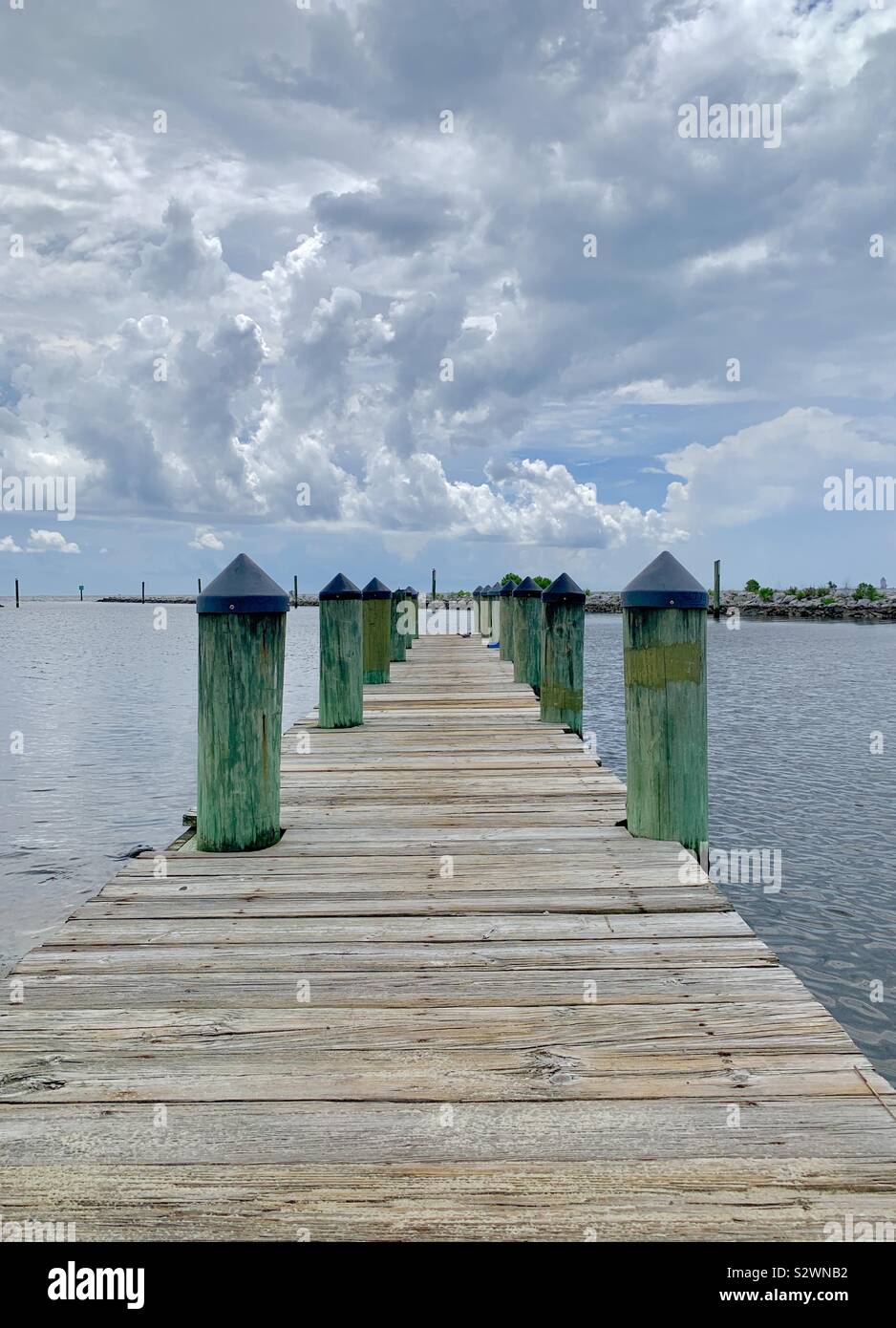 Wooden pier with view of Gulf of Mexico water Stock Photo