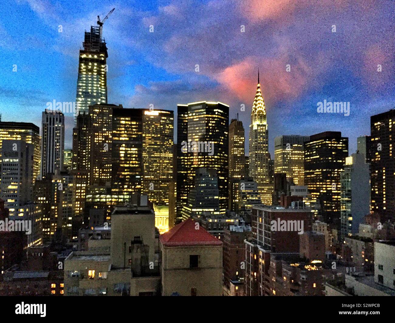 Pink clouds at sunset over Midtown Manhattan skyline, NYC, USA Stock Photo