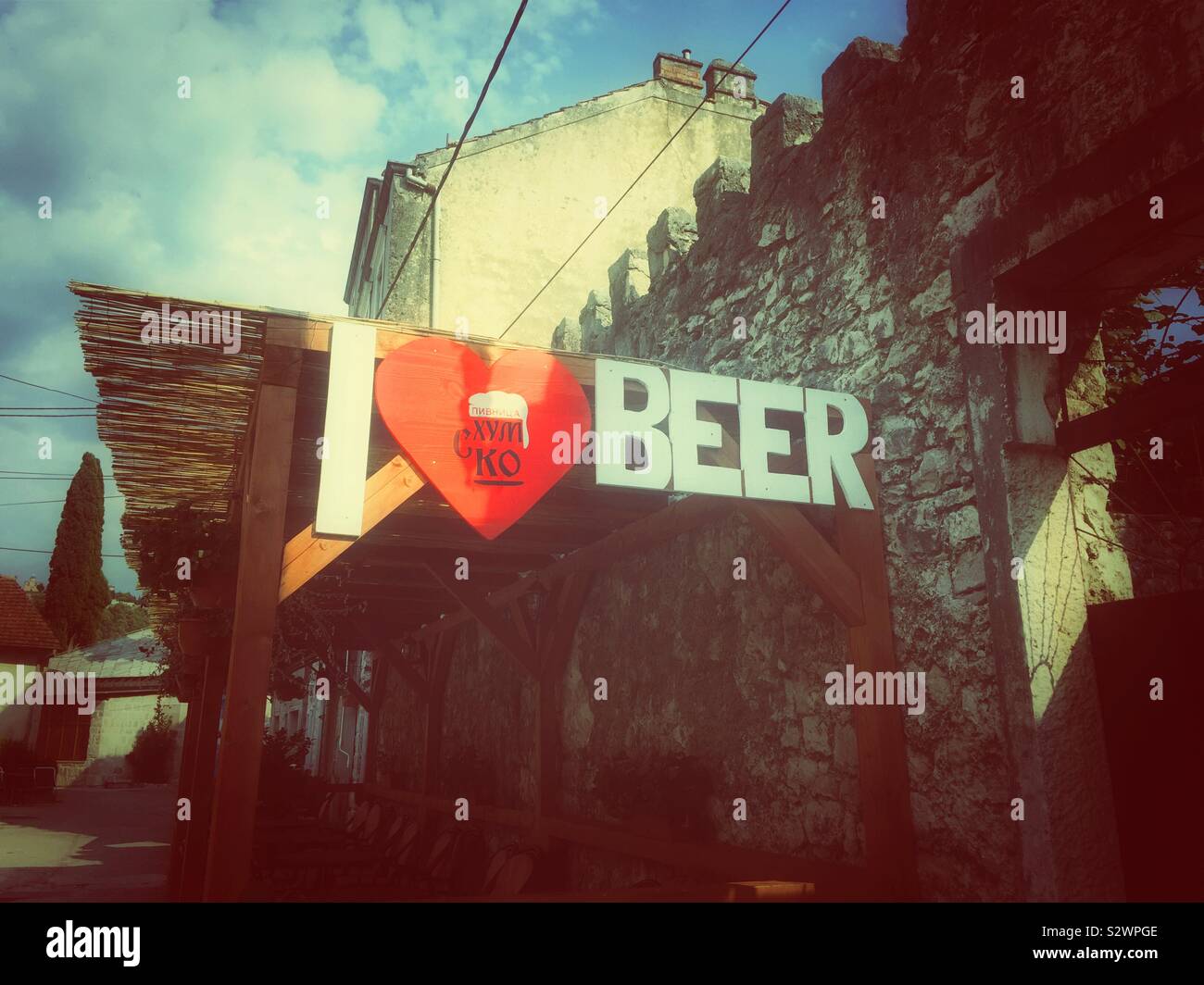 Sign outside a pub reads I heart beer - Smartphone Captured Stock Image