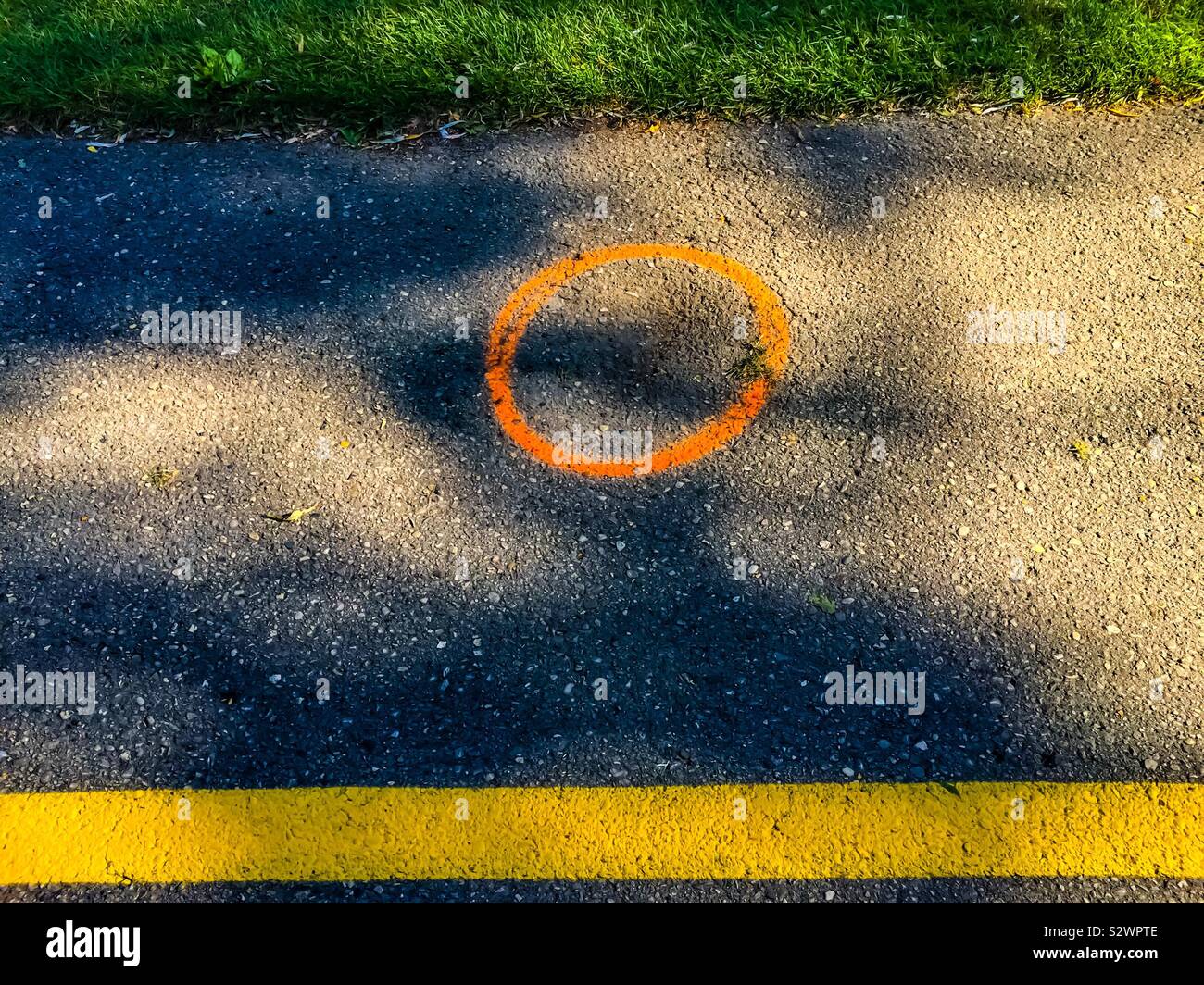 Orange circle between yellow and green. Geometry of space. Two strips. Simple design Stock Photo