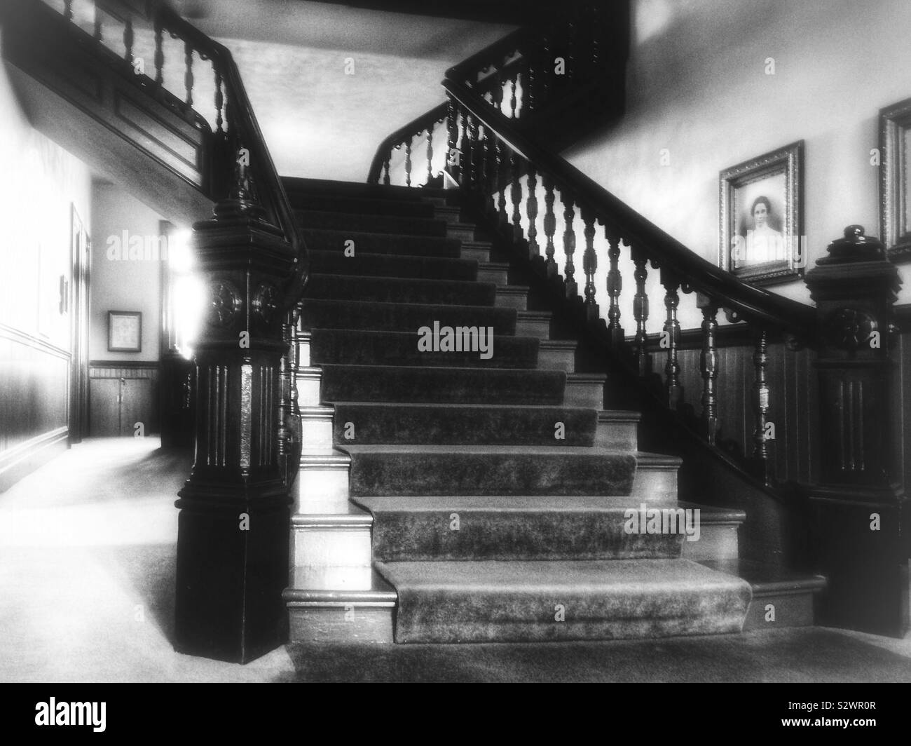 Vintage black and white photo of grand old stairs with wooden railings in Dayton, WA courthouse - Smartphone Captured Stock Image