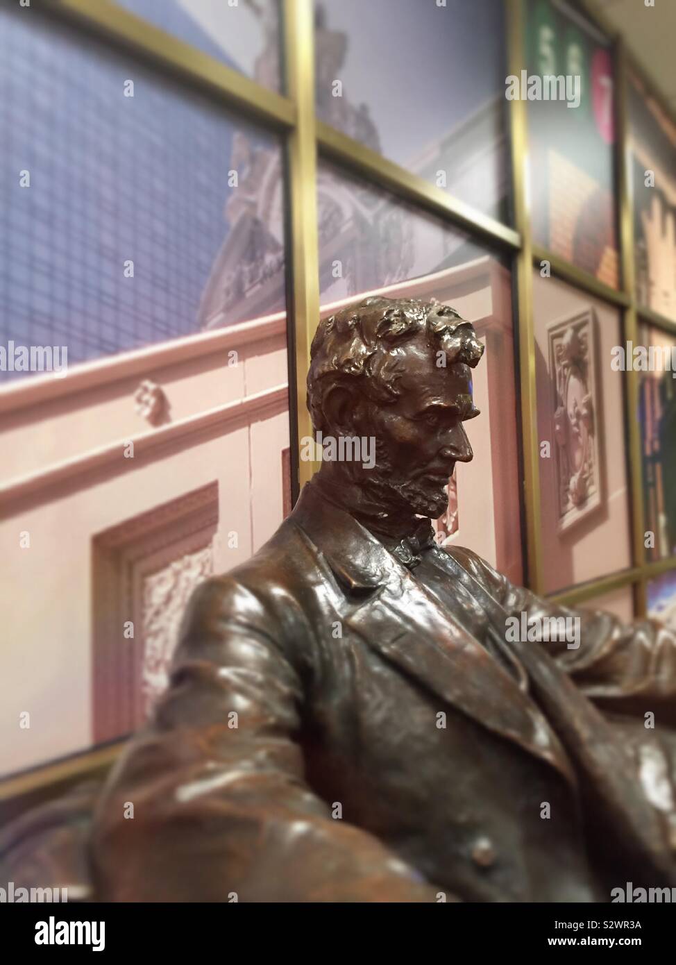 Small statue of Abraham Lincoln in the reception area lobby of One Grand Central Place, NYC, USA - Smartphone Captured Stock Image