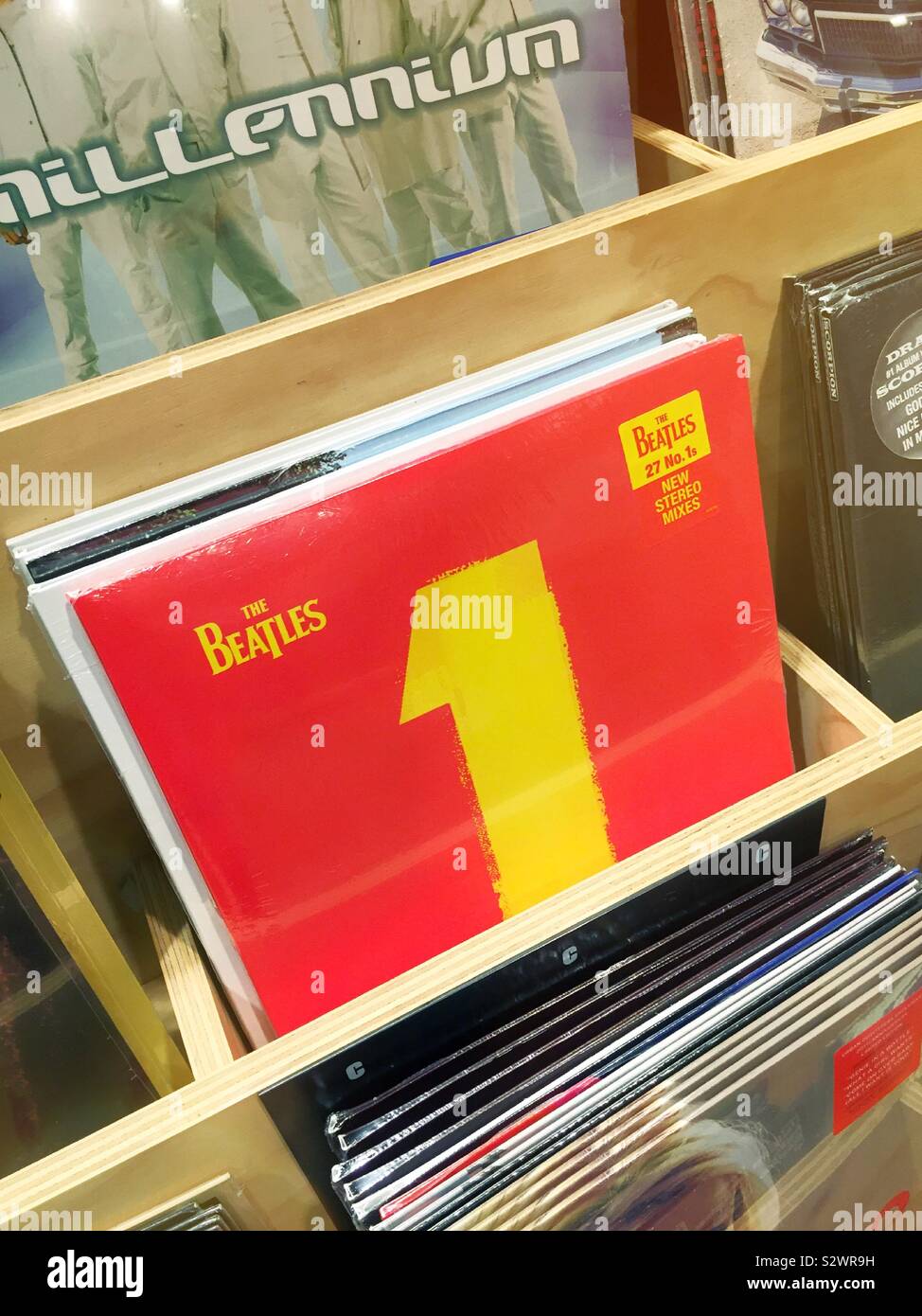 The Beatles number one album is featured in a vinyl record display in a retail shop, NYC, USA - Smartphone Captured Stock Image