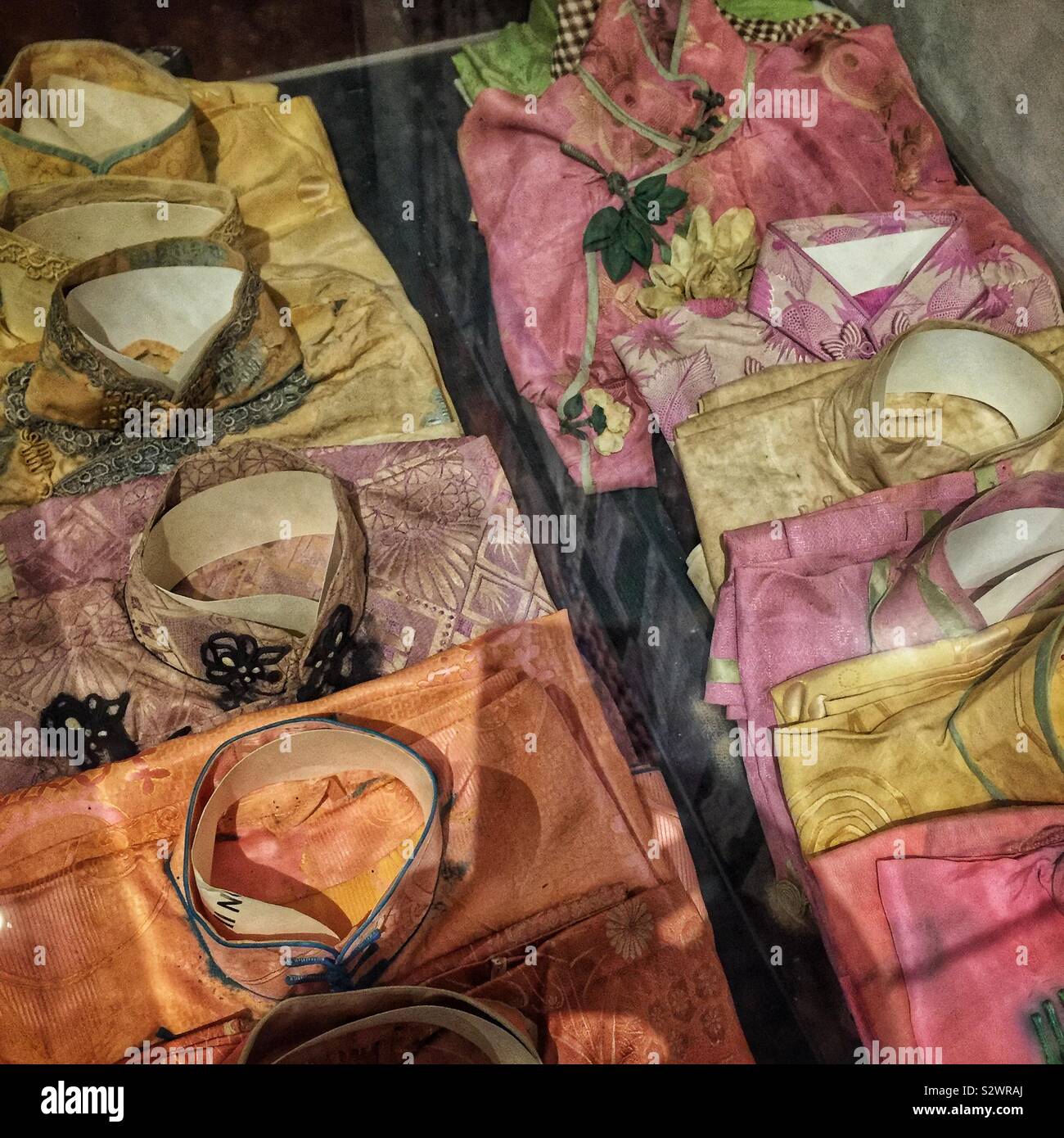 Vintage Chinese cheongsams found, and now on display in, Cheong Fatt Tze (aka The Blue Mansion), a late 19th century Chinese mansion now restored as a boutique hotel, George Town, Penang, Malaysia - Smartphone Captured Stock Image