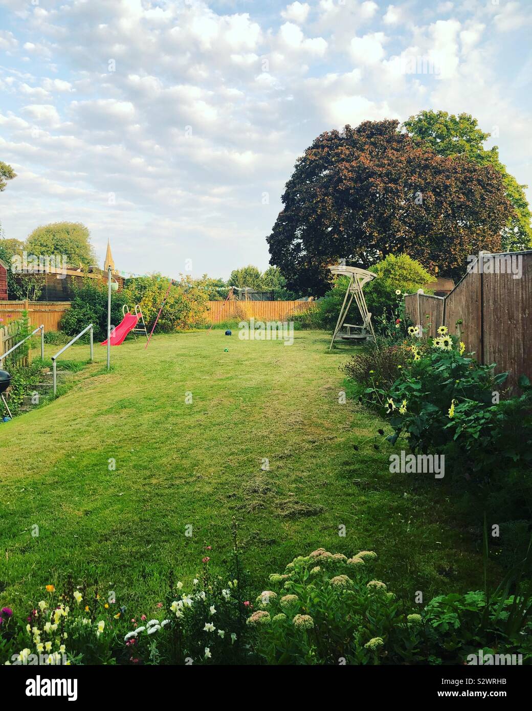 A residential back garden on a summer’s day. - Smartphone Captured Stock Image