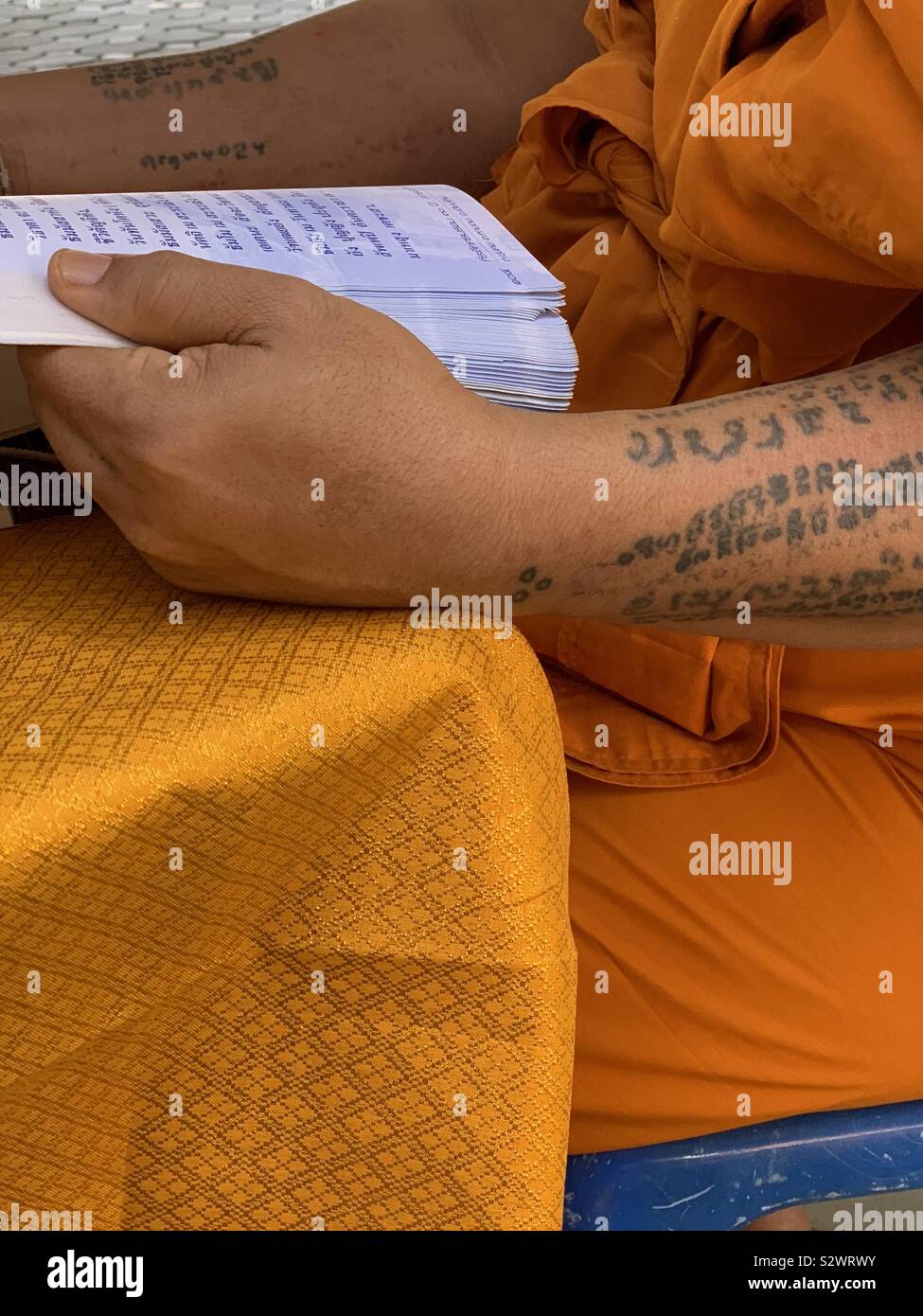 Buddhist monk reading - Smartphone Captured Stock Image