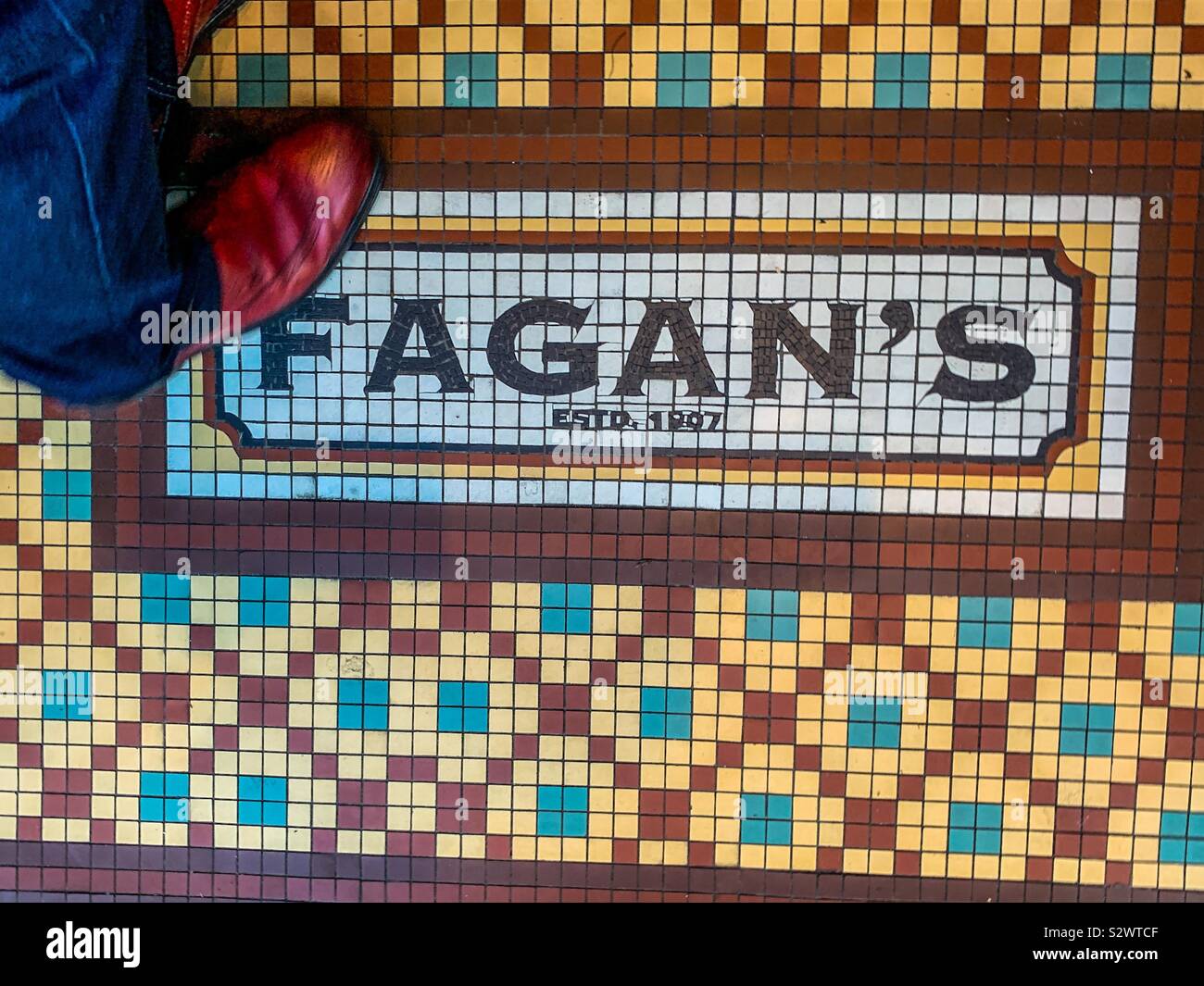 Tiled mosaic floor of Fagan’s pub in Dublin Ireland Stock Photo