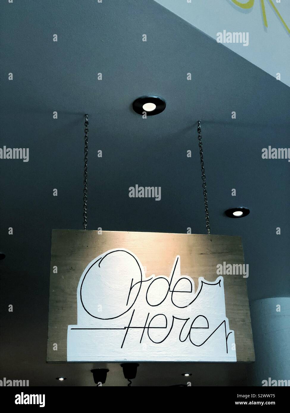 hand painted Order here sign in hipster cafe - Smartphone Captured Stock Image