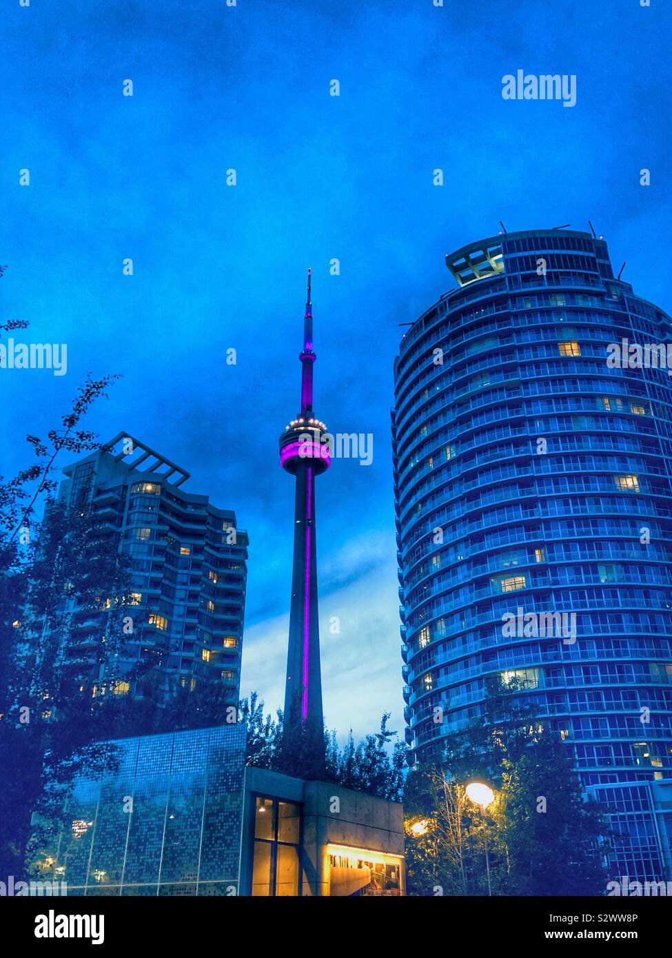 Toronto’s CN Tower illuminated at dusk. Stock Photo