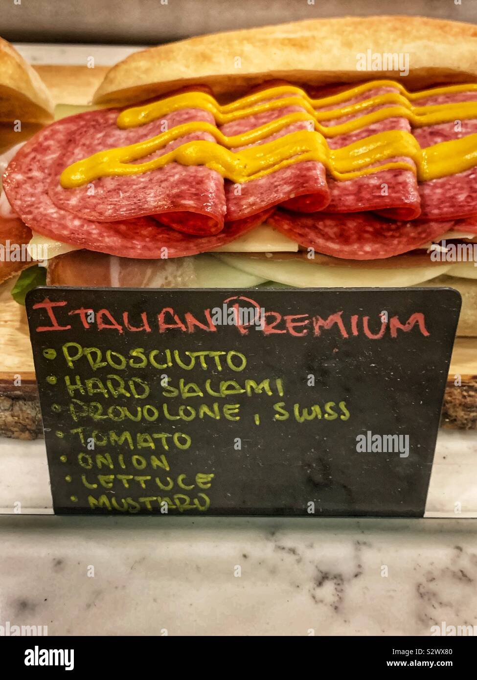 Italian premium sandwich with prosciutto, hard salami, provolone, Swiss