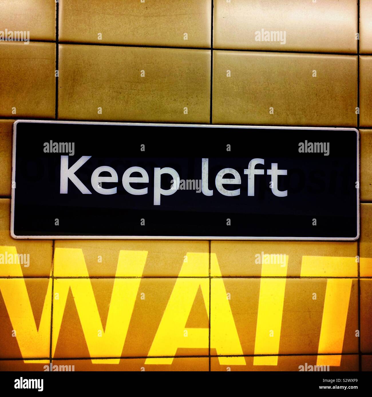 Keep left sign and wait caution sign Stock Photo