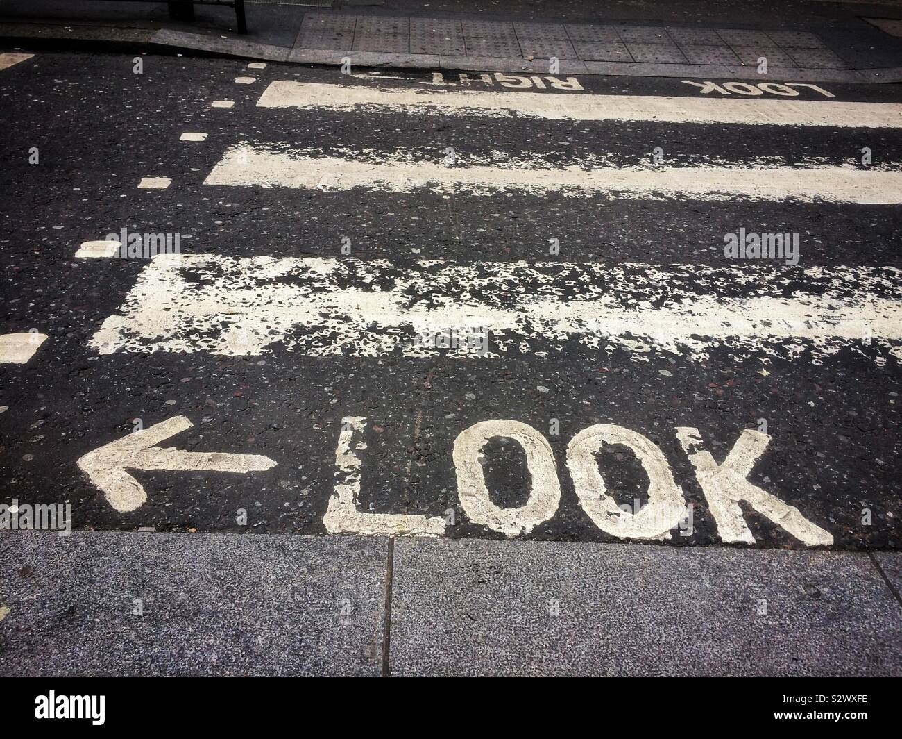 Look left sign on road Stock Photo