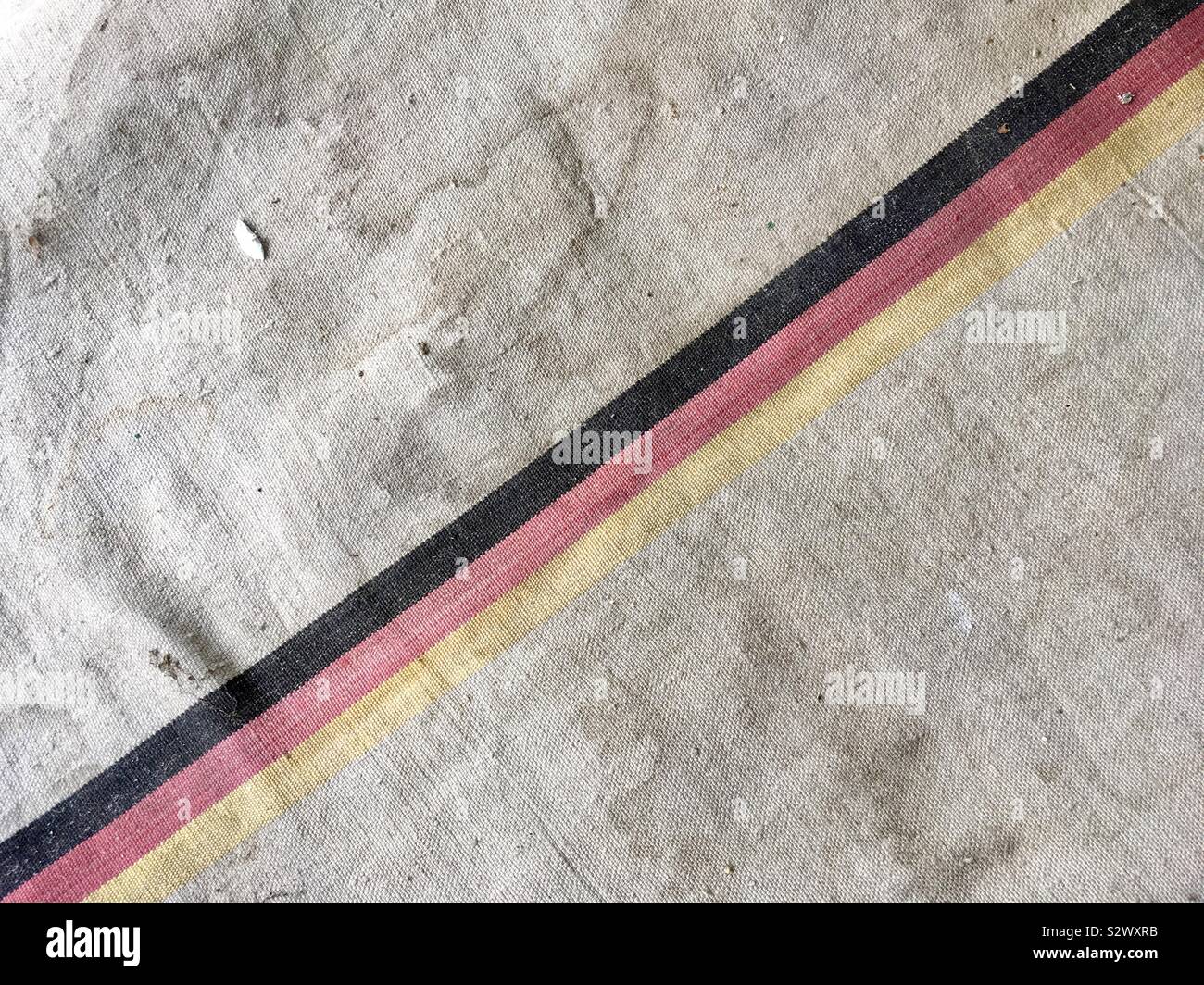 Detail of vintage original canvas cotton bag used by the Deutsche Bundespost (German federal post office) after WWII World War II with the German tricolour stripe - Smartphone Captured Stock Image