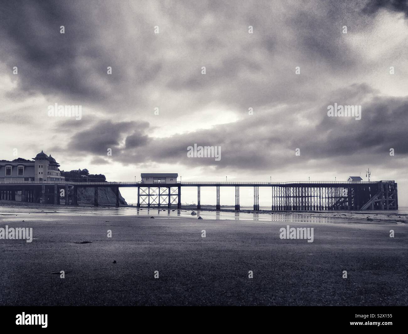 Penarth pier, South Wales, under a moody September sky, low tide. - Smartphone Captured Stock Image