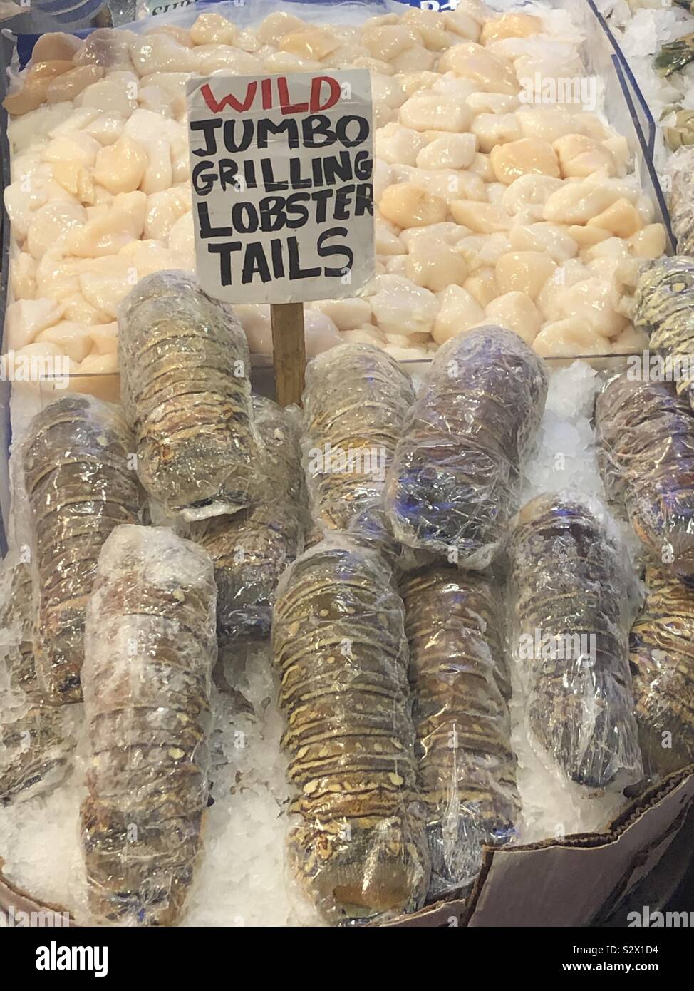 Lobster tails on market stall Stock Photo