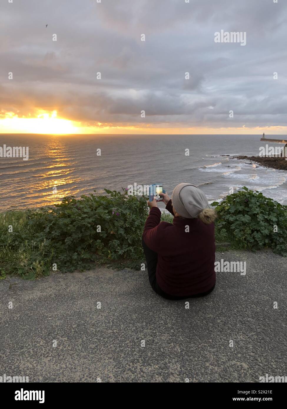Capturing the sunrise in Tynemouth UK - Smartphone Captured Stock Image