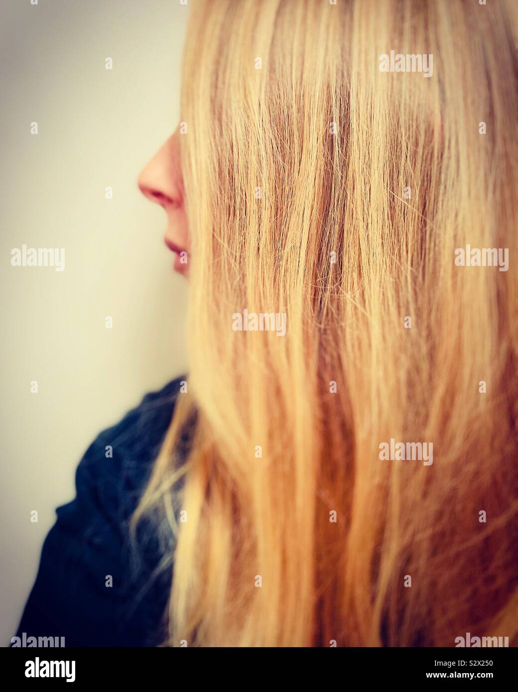 Profile of woman with long blonde hair Stock Photo
