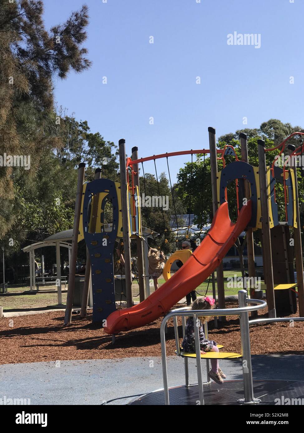 Children’s play parkchildrenplayparksummer funslideclimbong frame - Smartphone Captured Stock Image