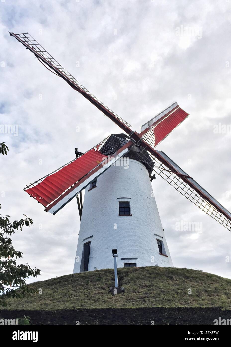 Working windmill near Damme, Brugge, Belgium with red sails - Smartphone Captured Stock Image