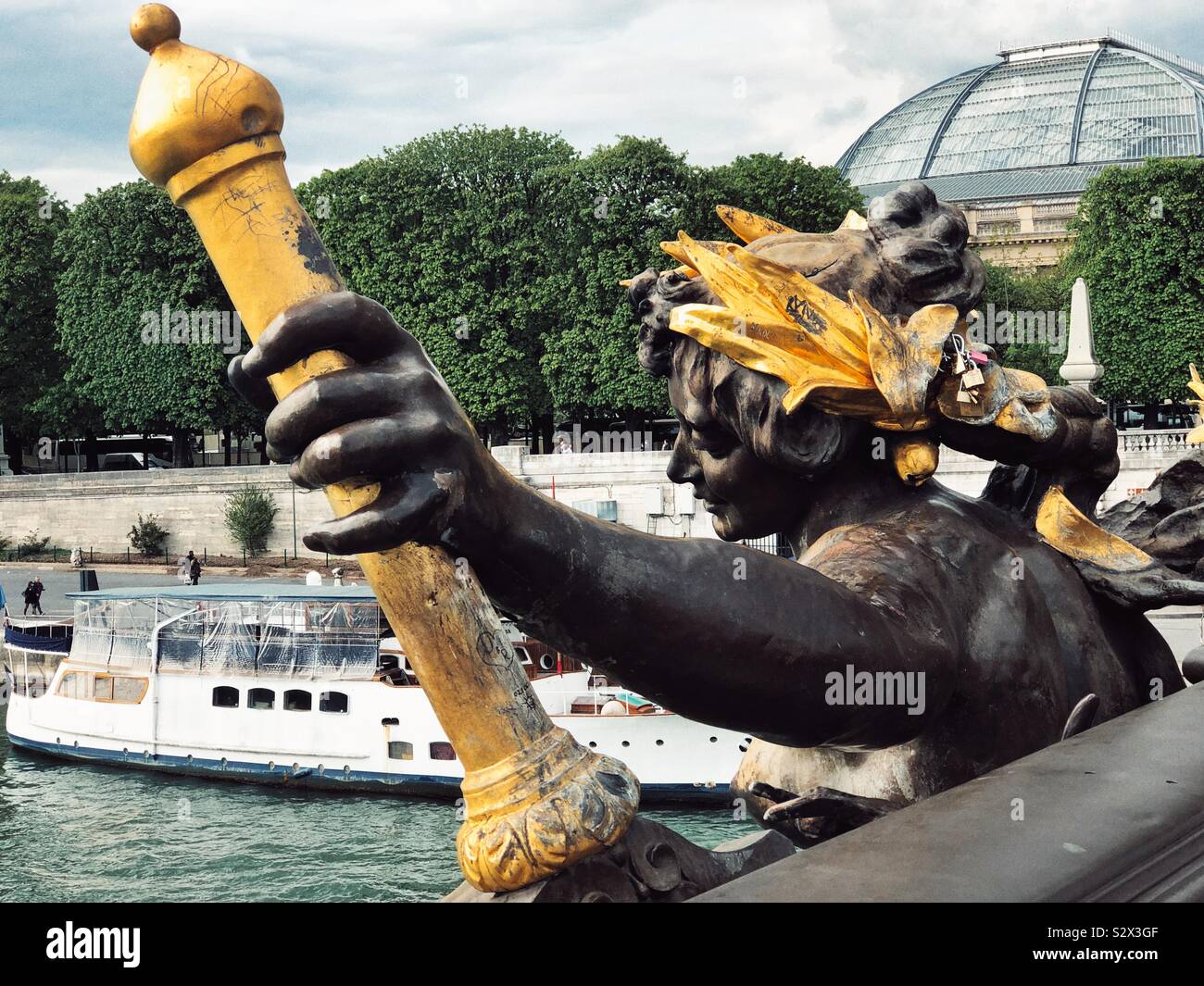 Nymph of Neva river with the coat of armes of Russia on the Pont Alexandre III in Paris Stock Photo