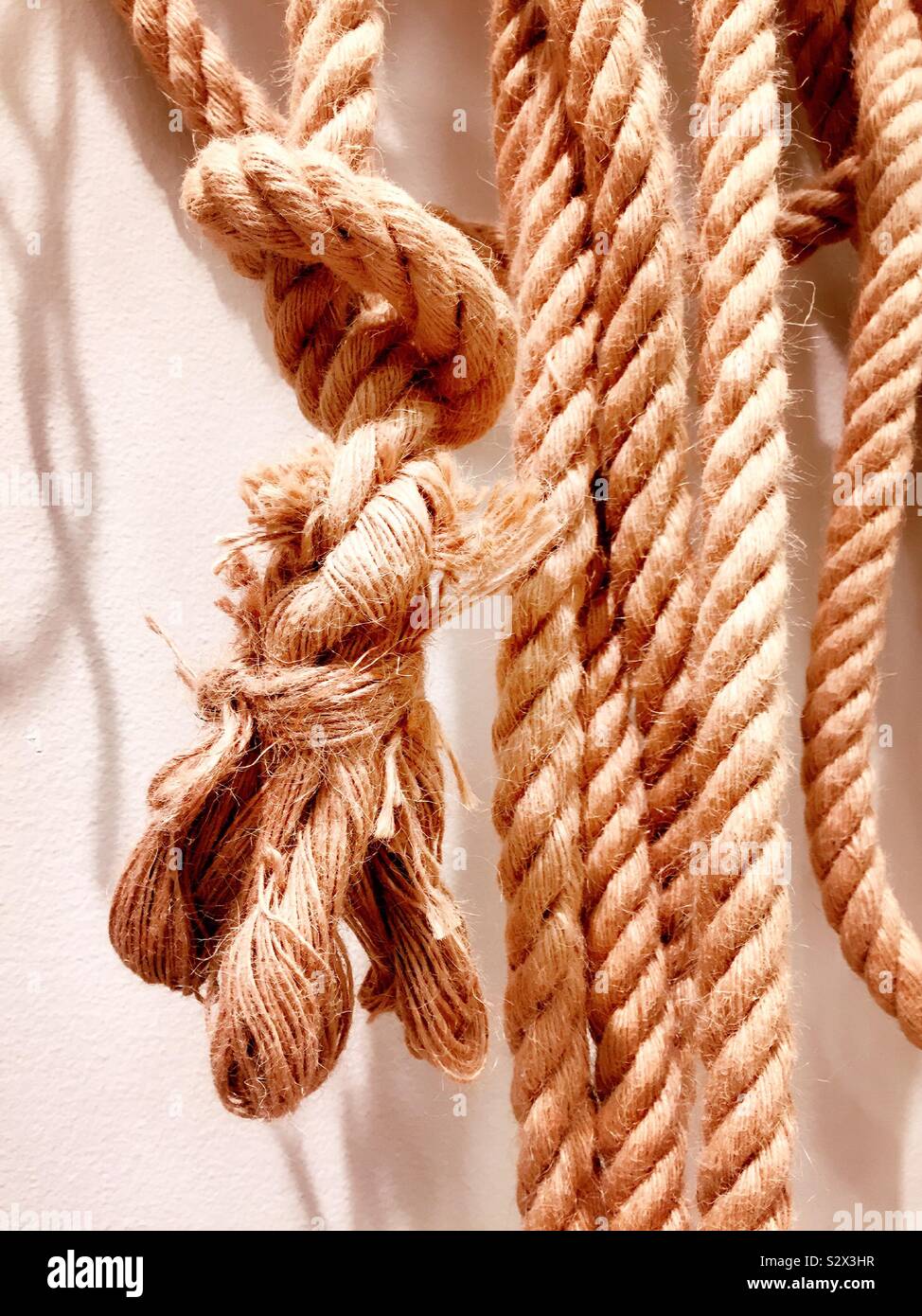 Close up of knots on strands of uncoiled ropes - Smartphone Captured Stock Image