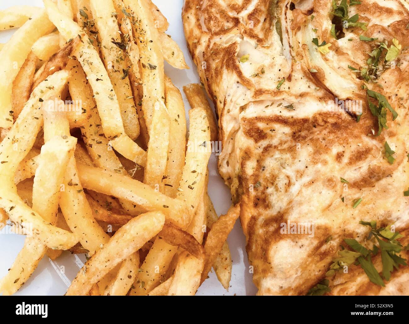 Cheese omelette with chips Stock Photo