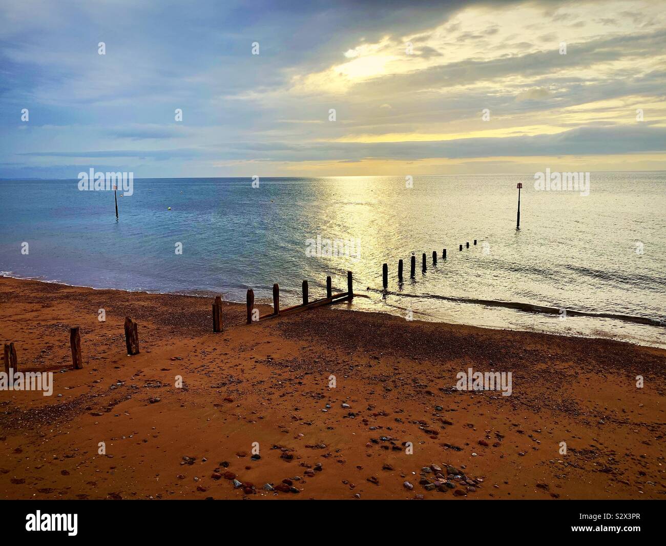 Sunrise on a red sand beach - Smartphone Captured Stock Image