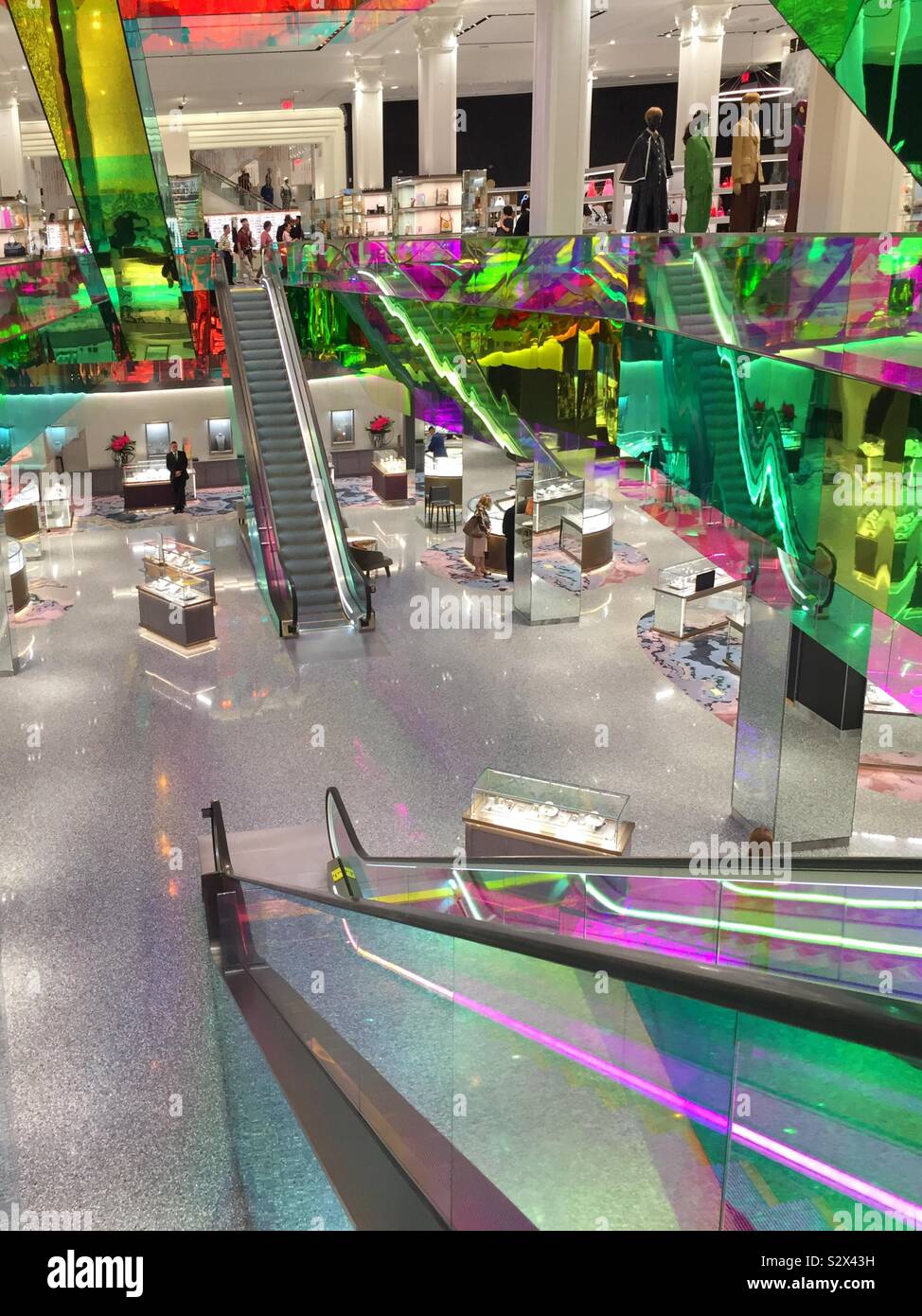 OMA adds iridescent glass escalator to New York's Saks Fifth Avenue