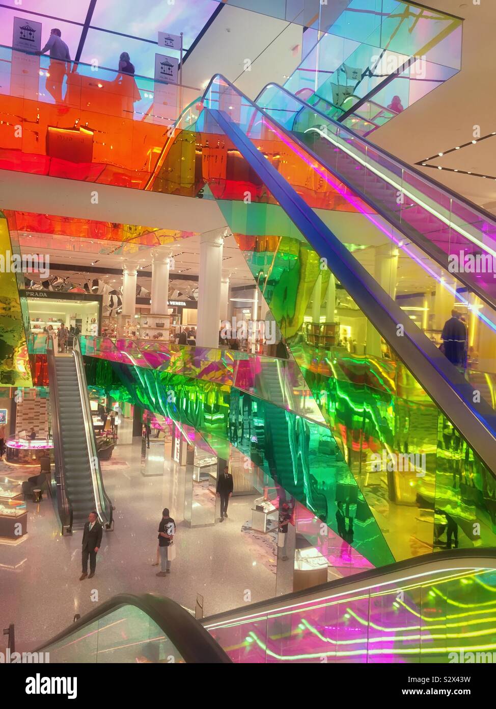 Remodeled Saks fifth avenue department store in Midtown Manhattan features  multi colored escalators on the first floor, NYC, USA Stock Photo - Alamy