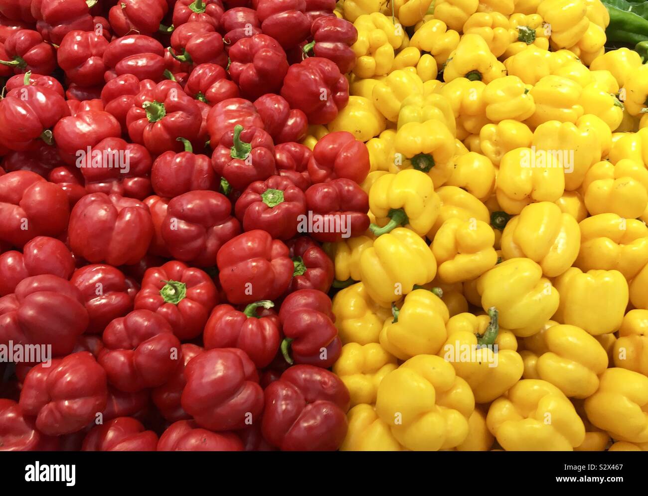 red and yellow peppers in a street market Stock Photo - Alamy