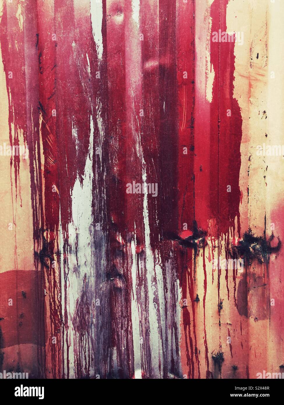 Red paint spills and drips on the wall Stock Photo Alamy