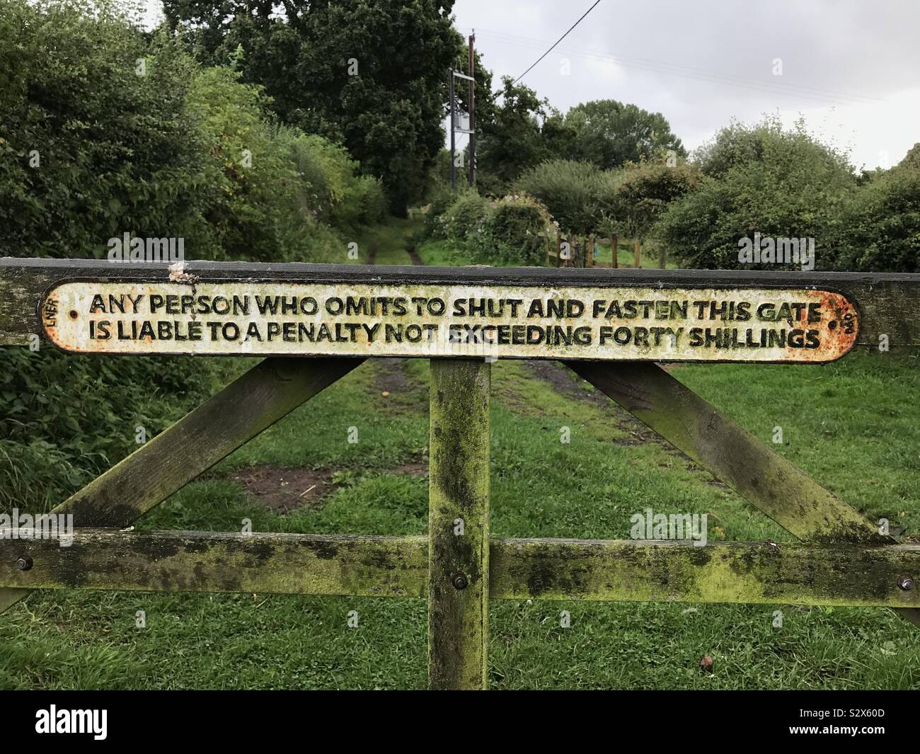 Old sign in a farm gate - Smartphone Captured Stock Image