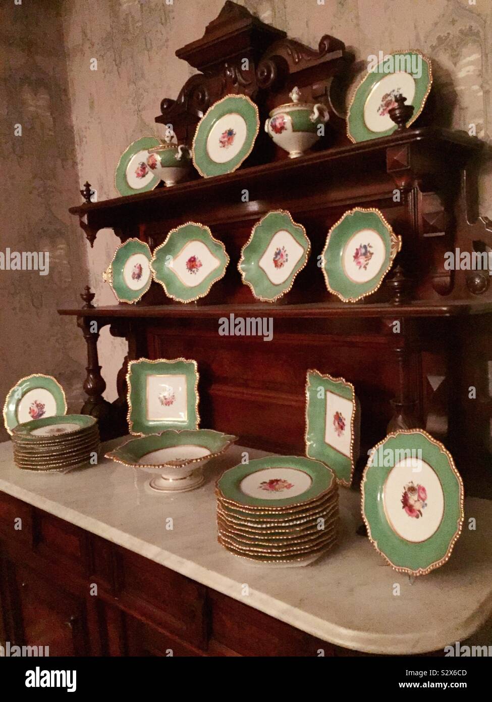 Antique China hutch and set of dinnerware at the Theodore Roosevelt birthplace national historic site, New York City, United States - Smartphone Captured Stock Image