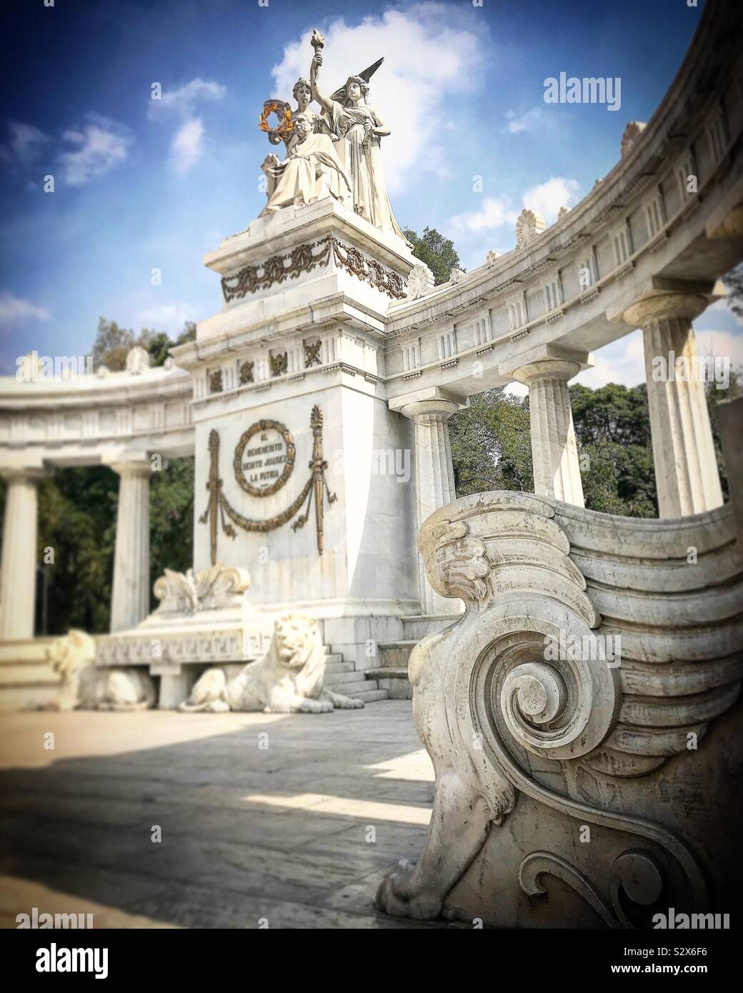 A sphinx (down right) decorates Benito Juarez monument in the Alameda square in Mexico City, Mexico. - Smartphone Captured Stock Image