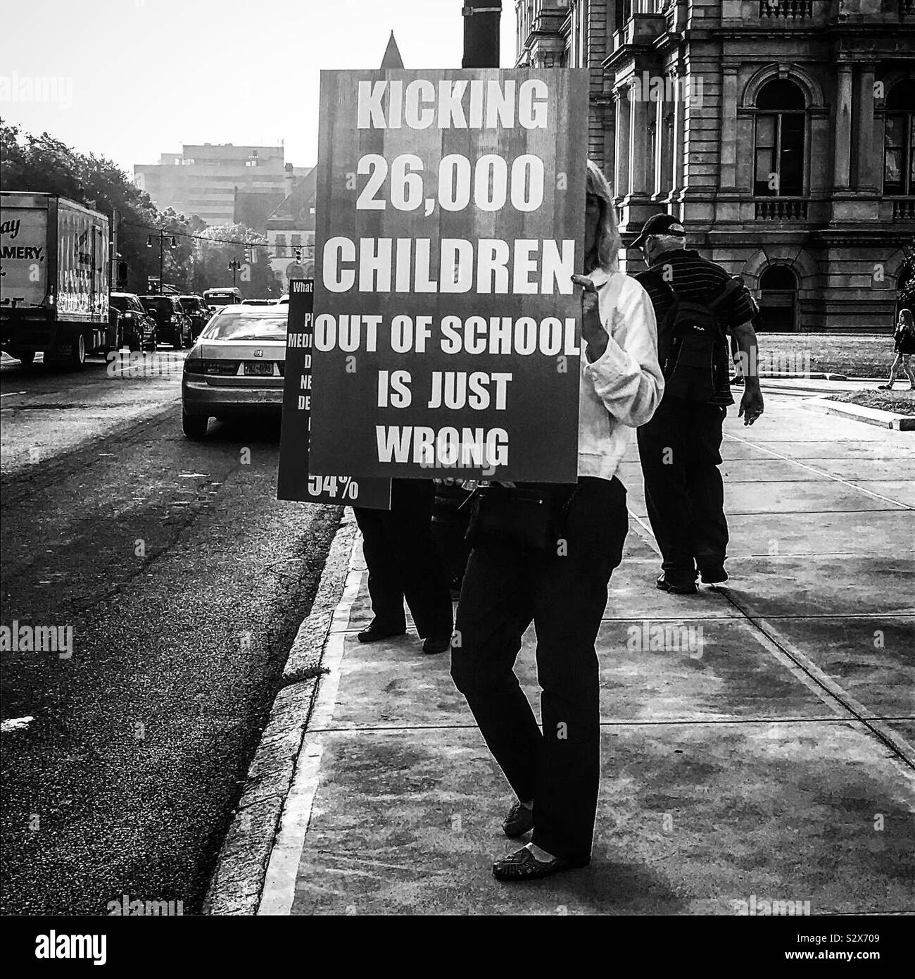 An anti-vaxer holding a protest sign outside the education building in Albany New York Stock Photo