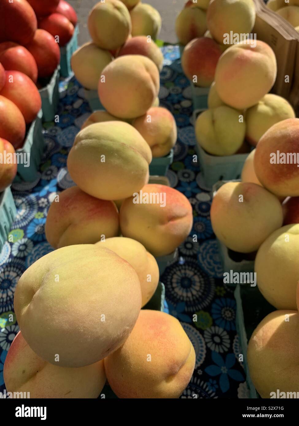 Fresh peaches at farmers market Stock Photo