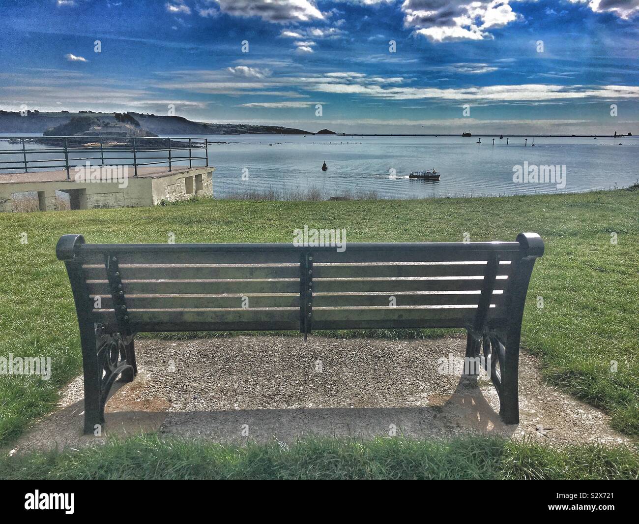 Bench overlooking the Plymouth Sound and Drake’s Island in Devon U.K. Stock Photo