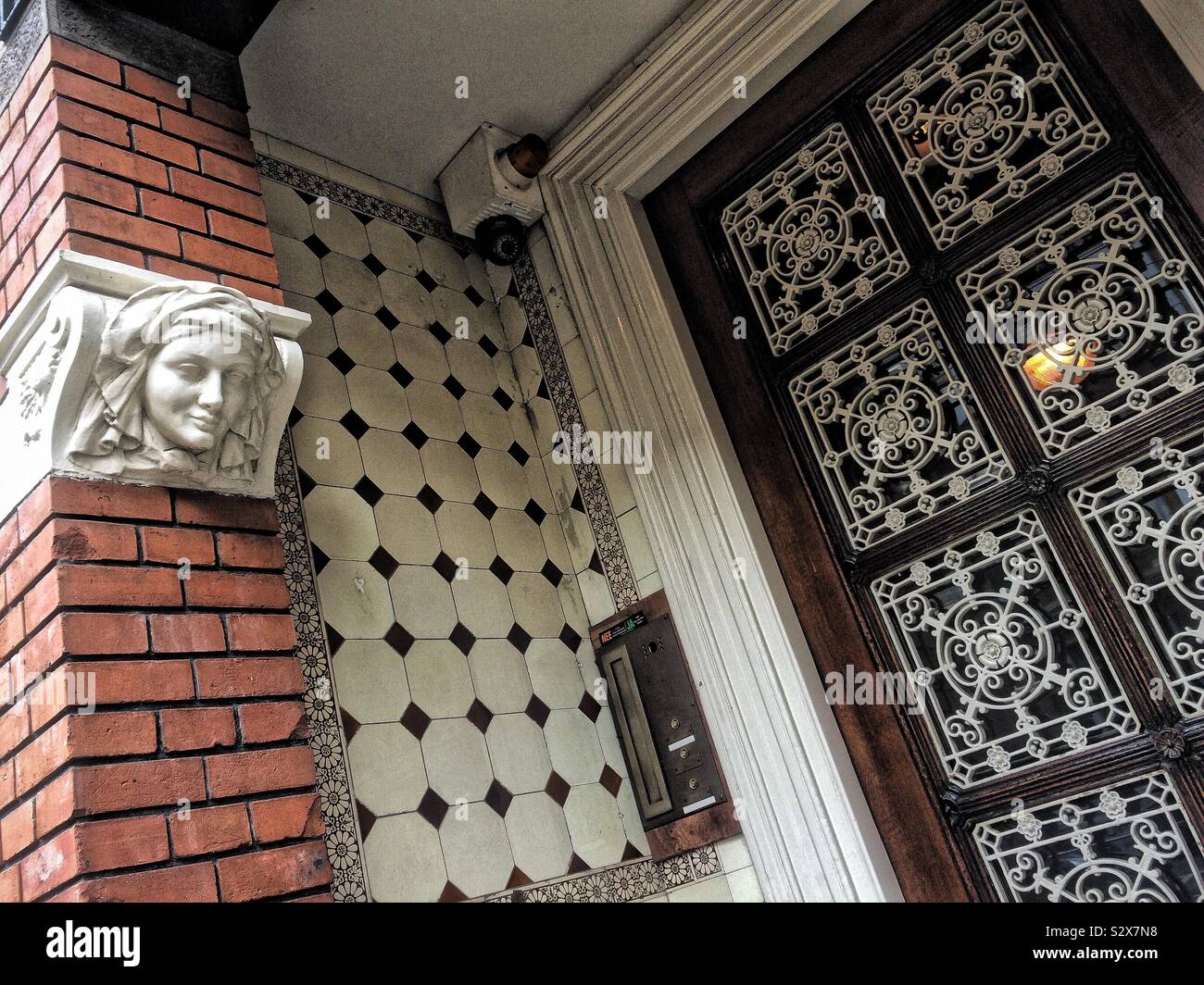 Decorations in the doorway of a period canal-side house in Amsterdam - Smartphone Captured Stock Image