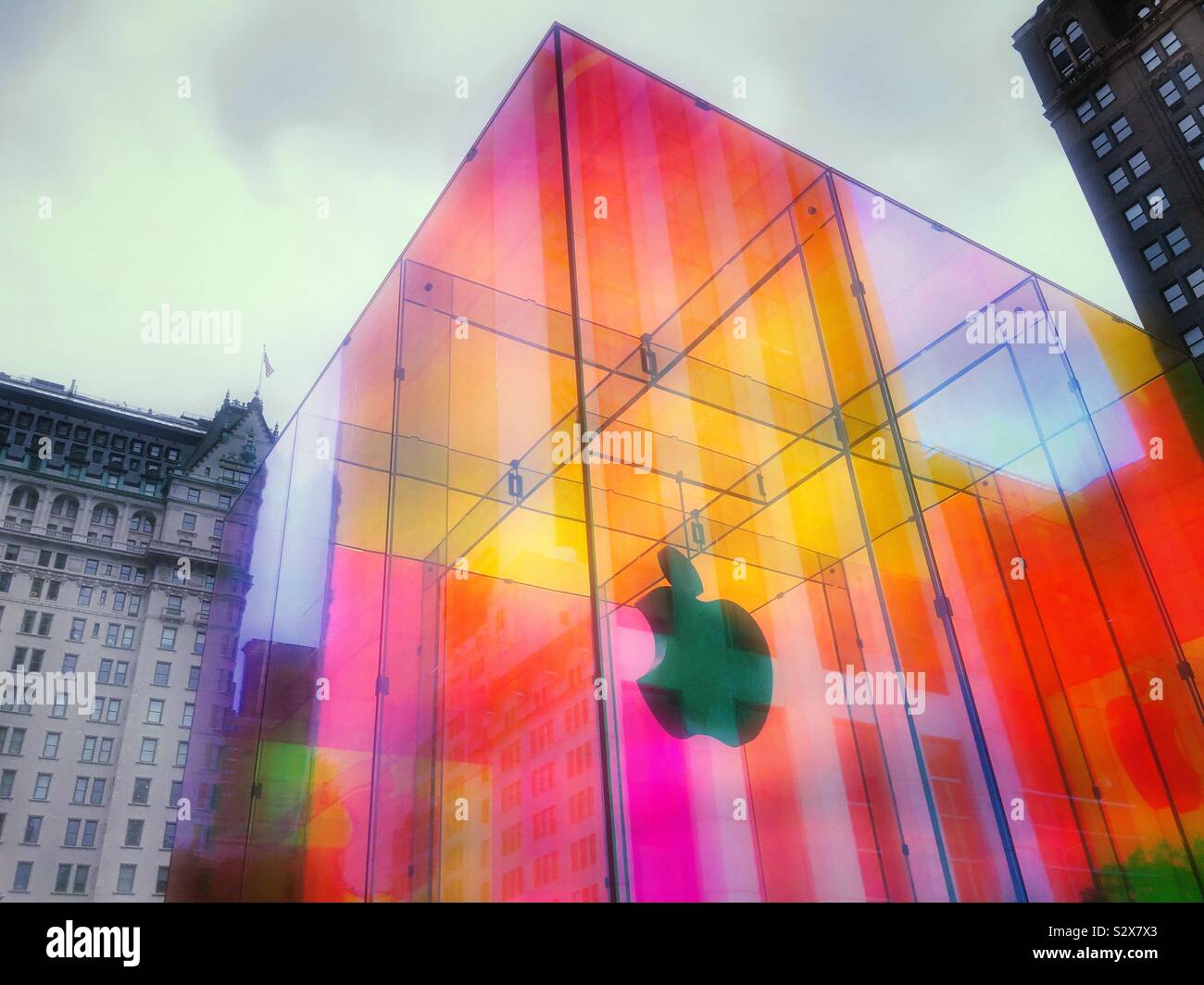 The iconic Apple store cube on fifth Avenue is located across from the famous plaza hotel and wrapped in a temporary iridescent wrap, NYC, USA - Smartphone Captured Stock Image