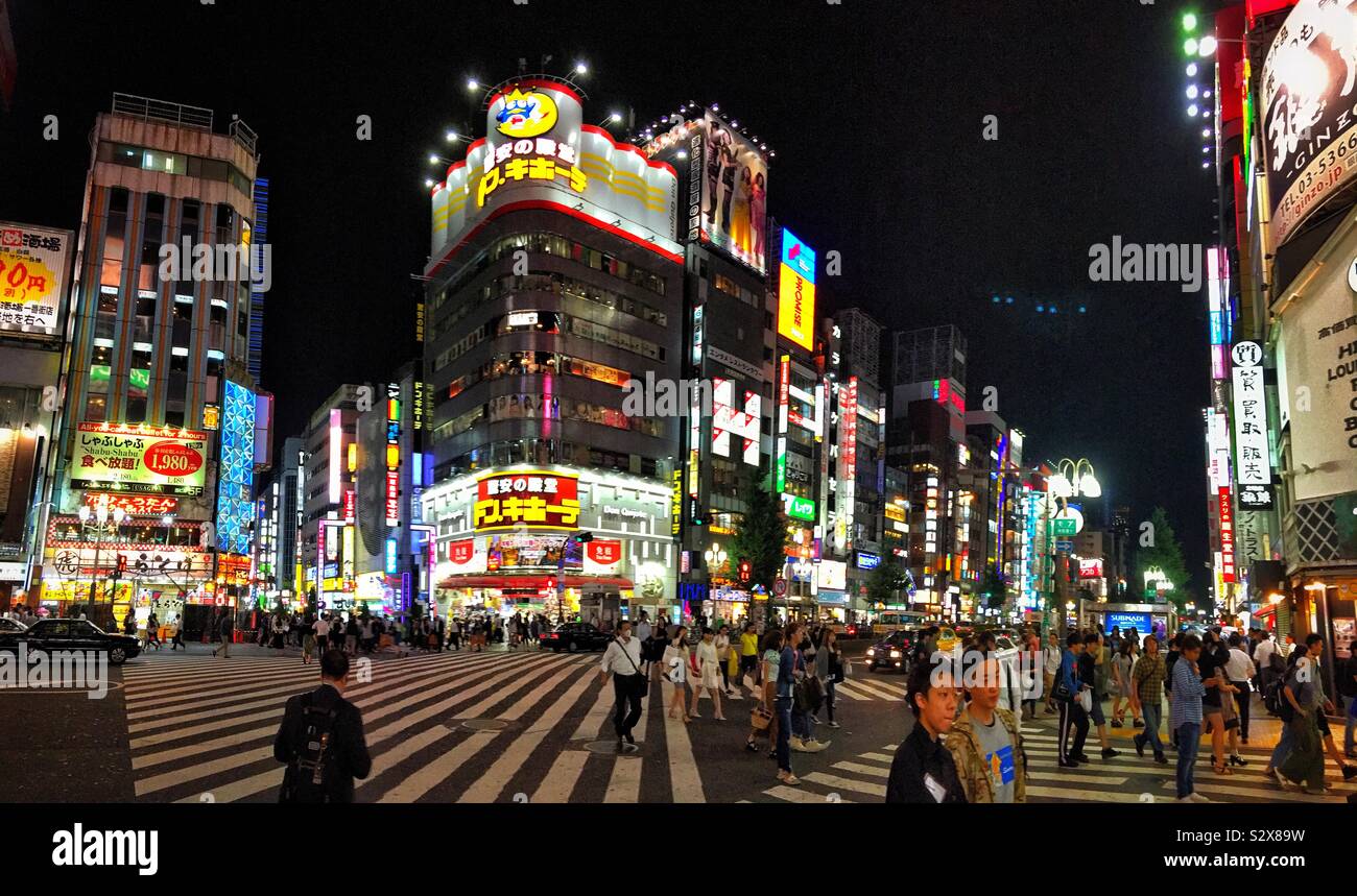 Shinjuku street scene at night in Tokyo Stock Photo