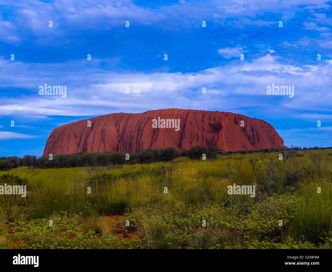 Cloudy Sunset at Ayers Rock in Australia Stock Photo